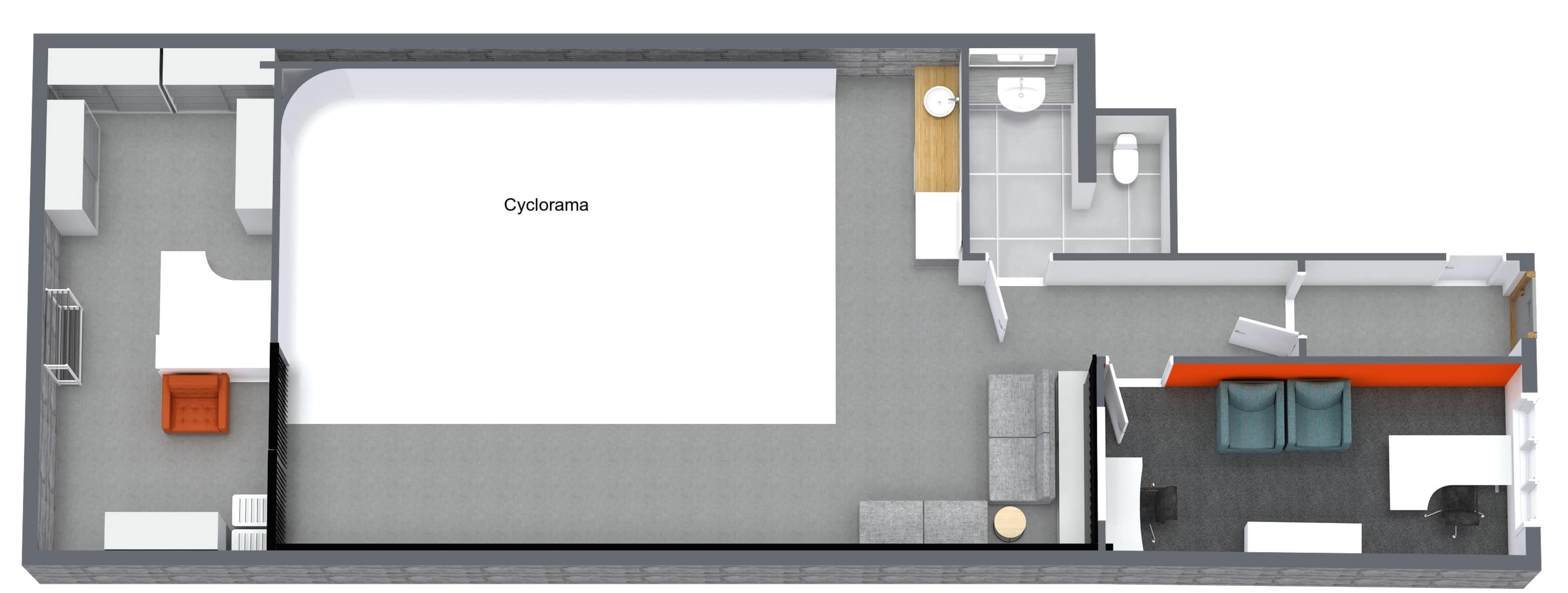 The image shows a floor plan of a room, featuring a cyclorama area, seating arrangements, a bathroom, and designated spaces for work and storage.