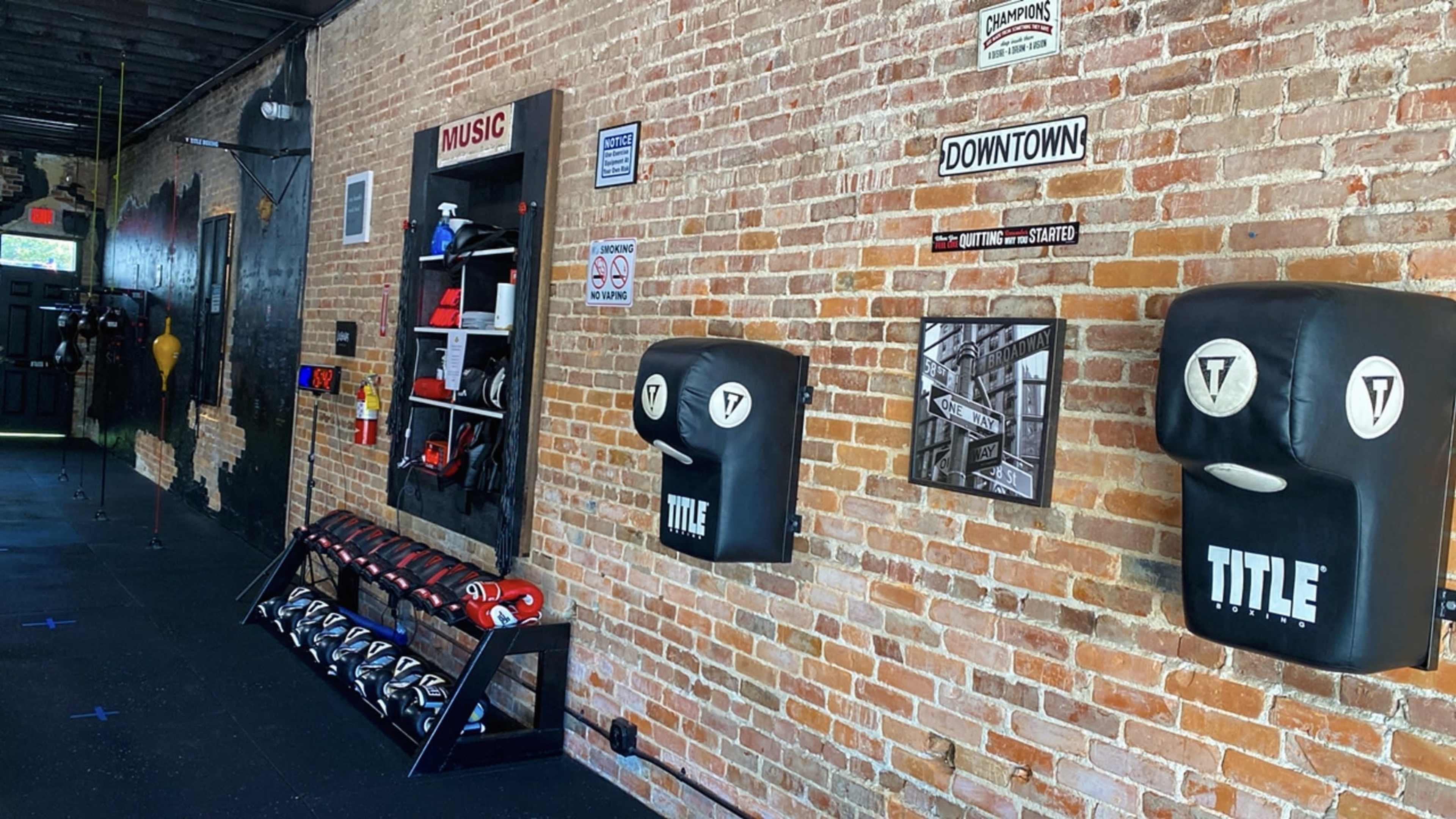 Full Boxin Gym / Boxing Ring / Punching Bags / Weights Area (Old Bricks Walls) (Black Walls) Downtown Saint Cloud Fl Image in St. Cloud, Saint Cloud, FL