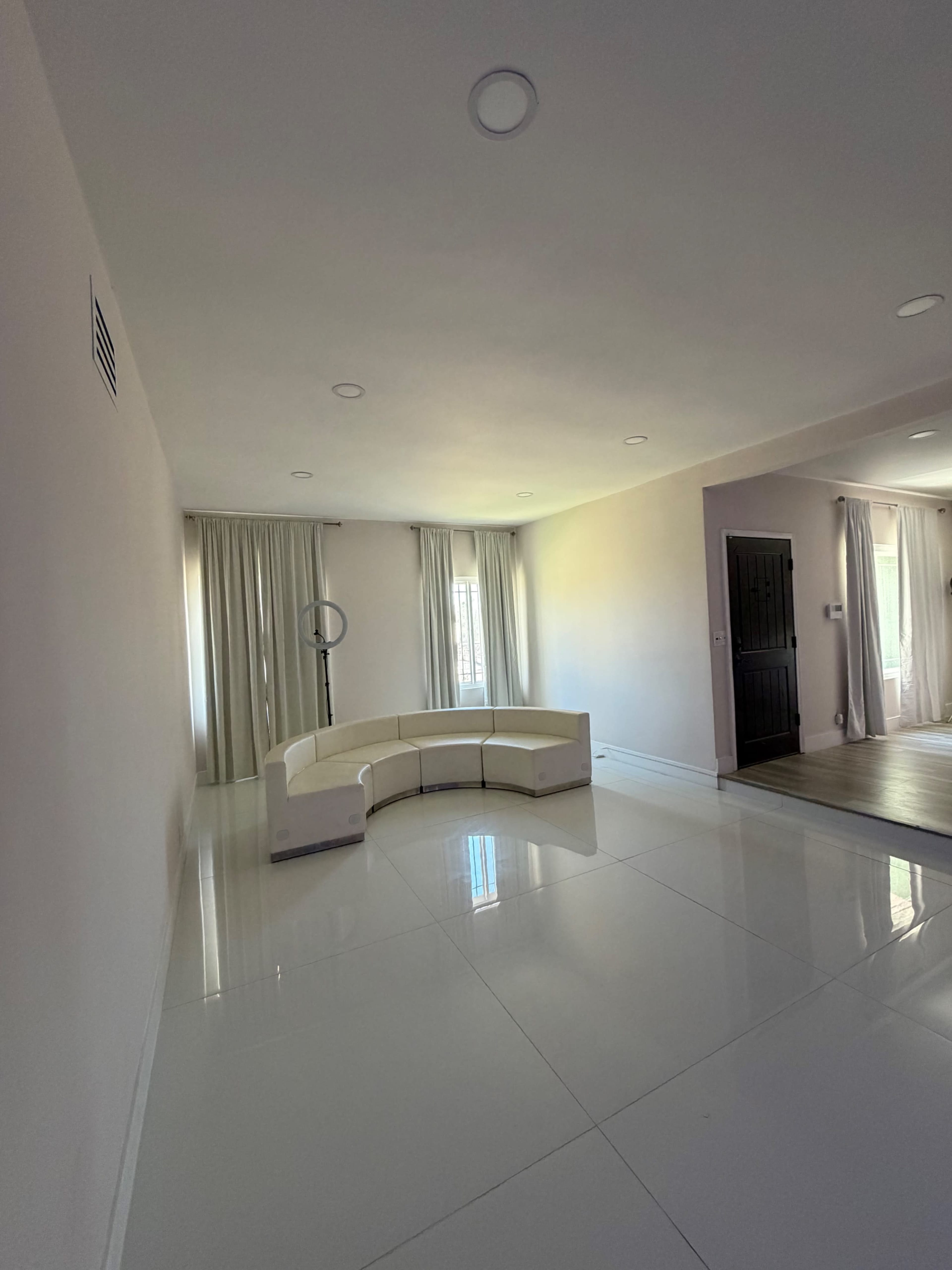 Modern White Room with TV Wall Image in The Section 10, Las Vegas, NV