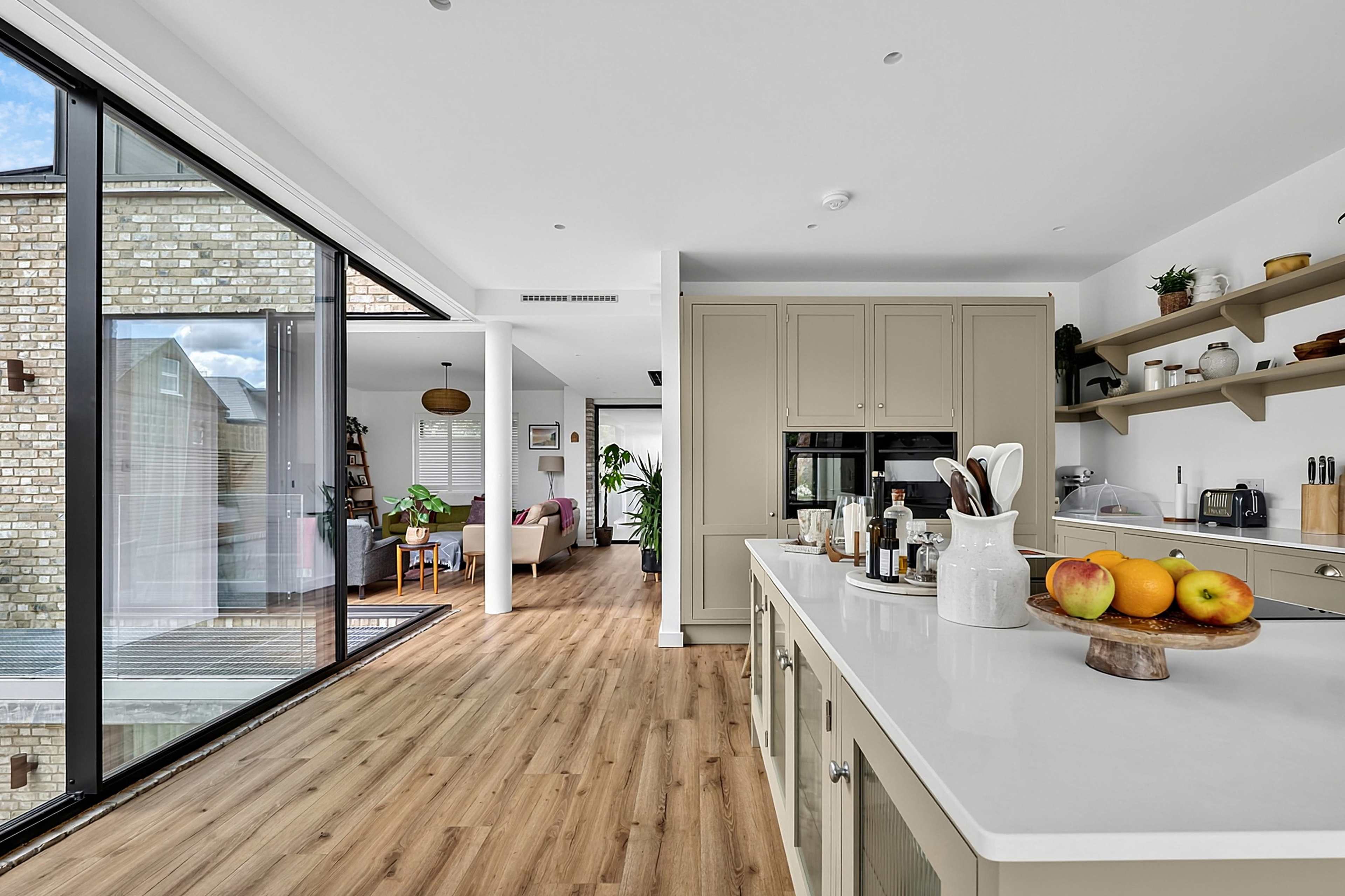 Architect Designed Modern Home with Panoramic Glass, Sunken Courtyard, Feature Brick Wall and Log Burner Image in London, London, ENG