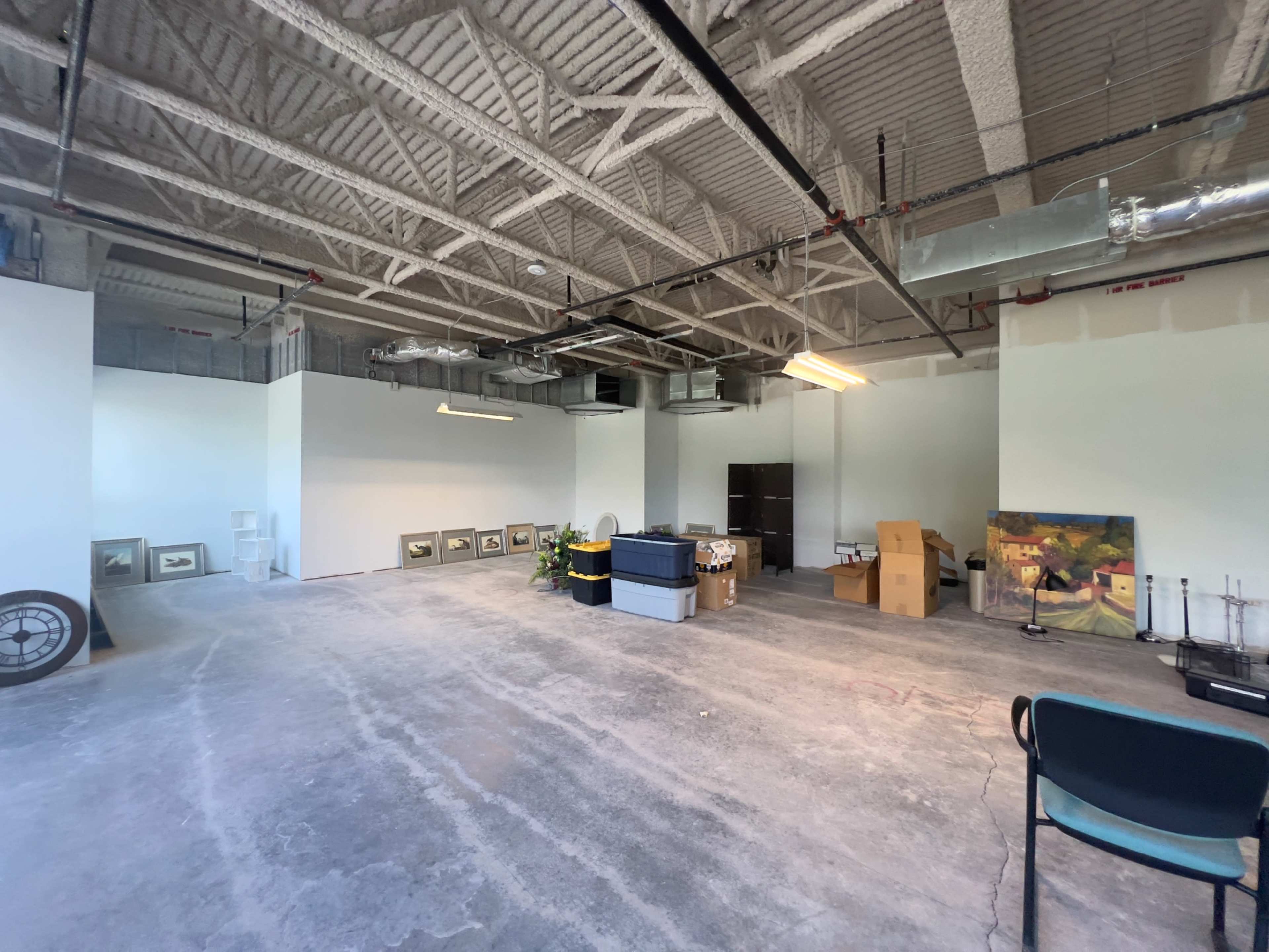Industrial Studio space, white walls, concrete floors, high ceilings. Image in Central Newport News, Newport News, VA