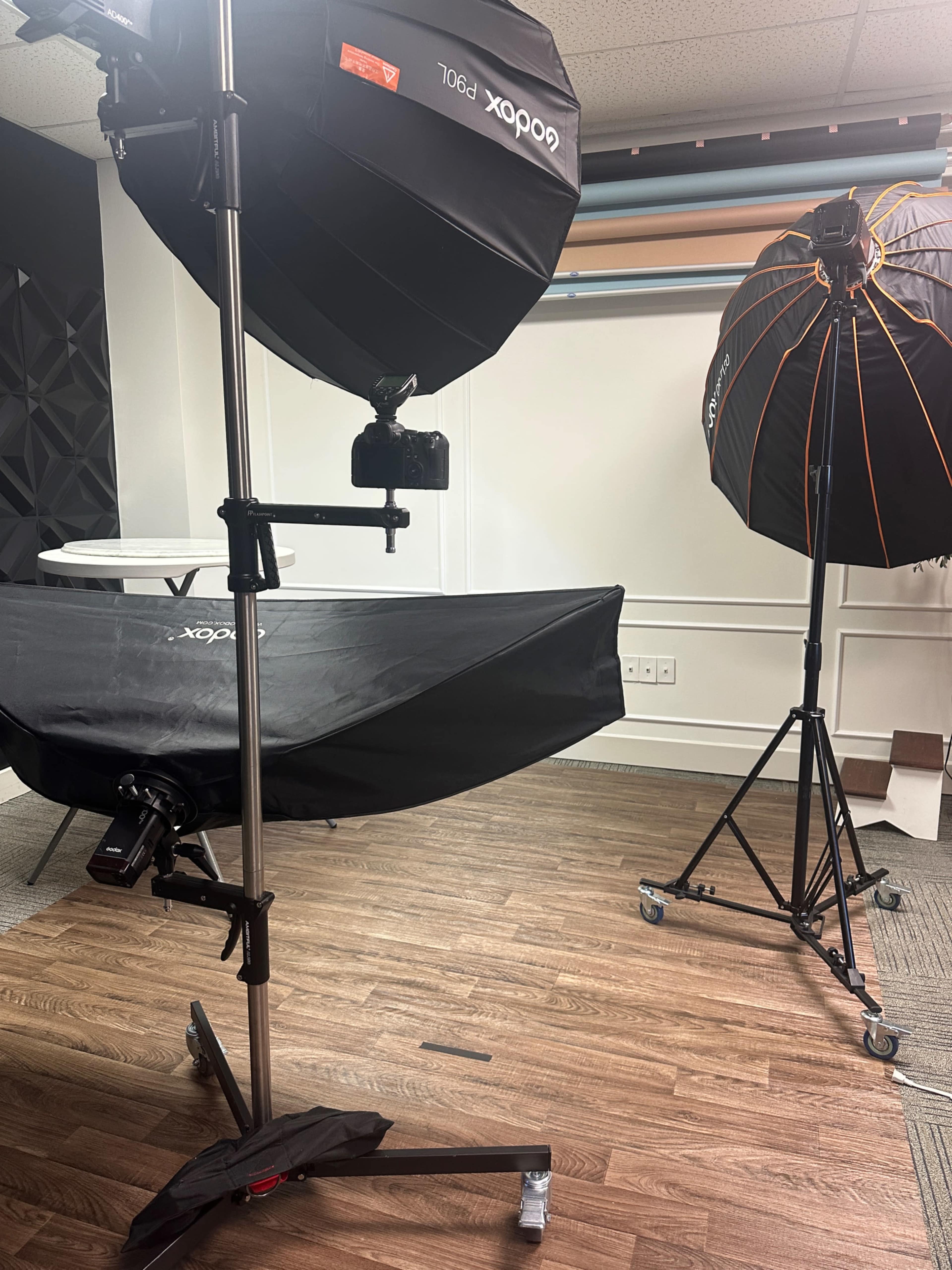 Photo studio with large windows. Two rooms. One is perfect for hair and makeup and branding images. The other has seamless paper, a unique textured wall and couch. Image in Granville Township, Granville, OH