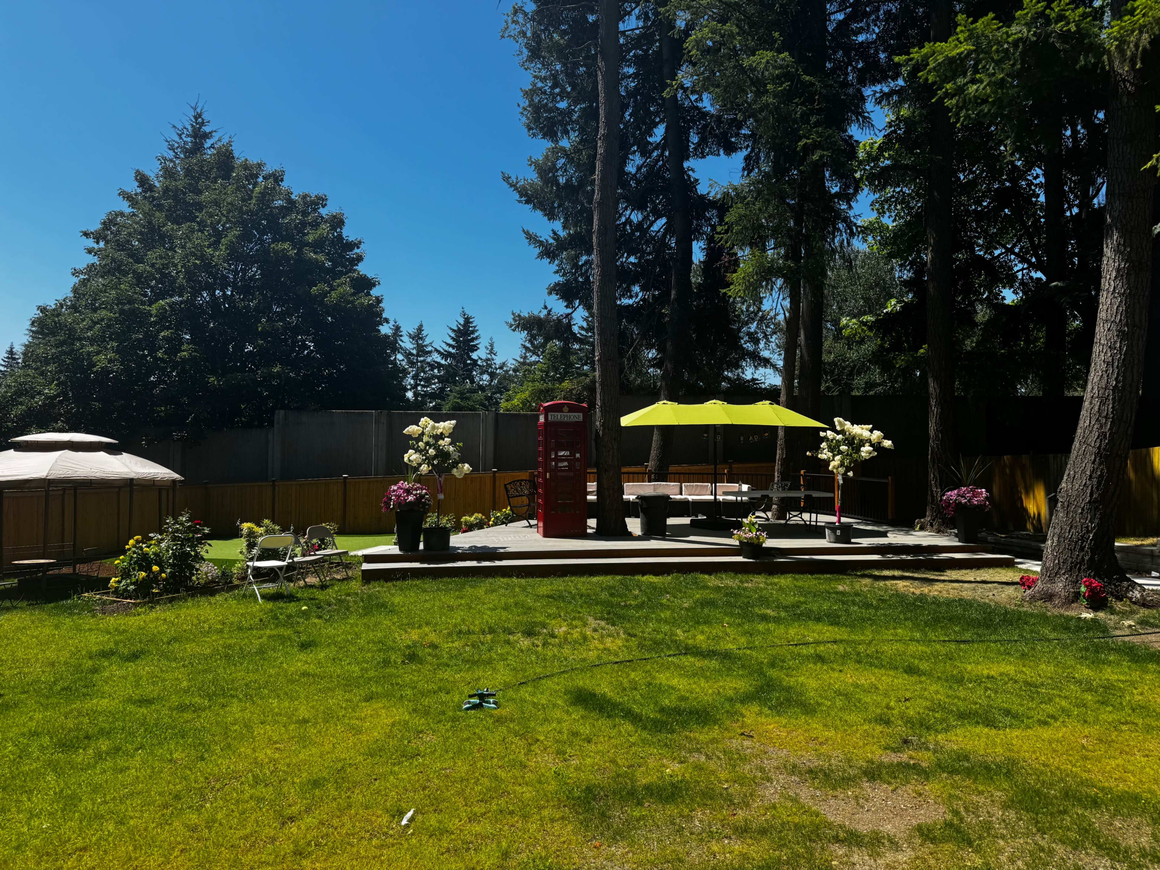 Unique back yard venue with a Basketball court, putting Green, beautiful garden and Bar. Image in Kingsgate, ne kirkland, WA