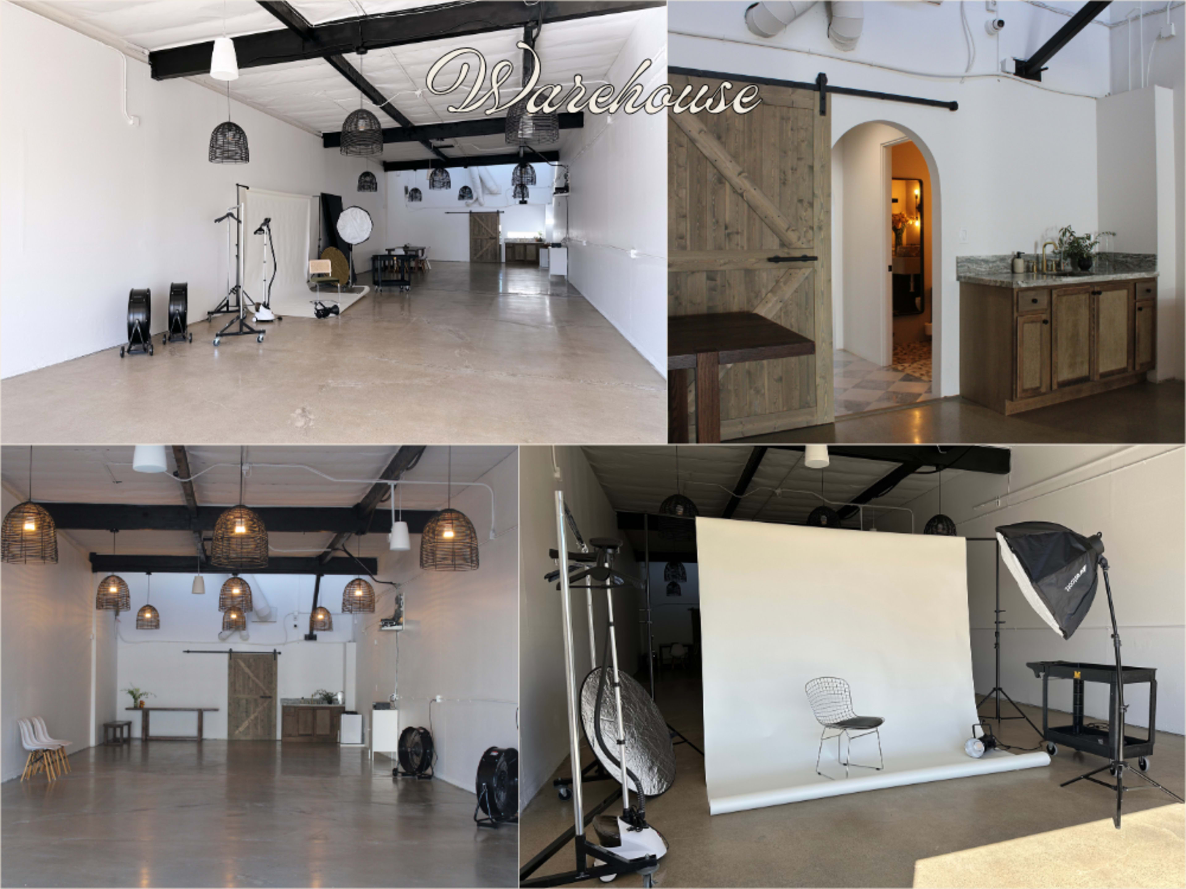 The image showcases a spacious warehouse interior with high ceilings, equipped with photography backdrops, lighting equipment, and a small kitchenette area.