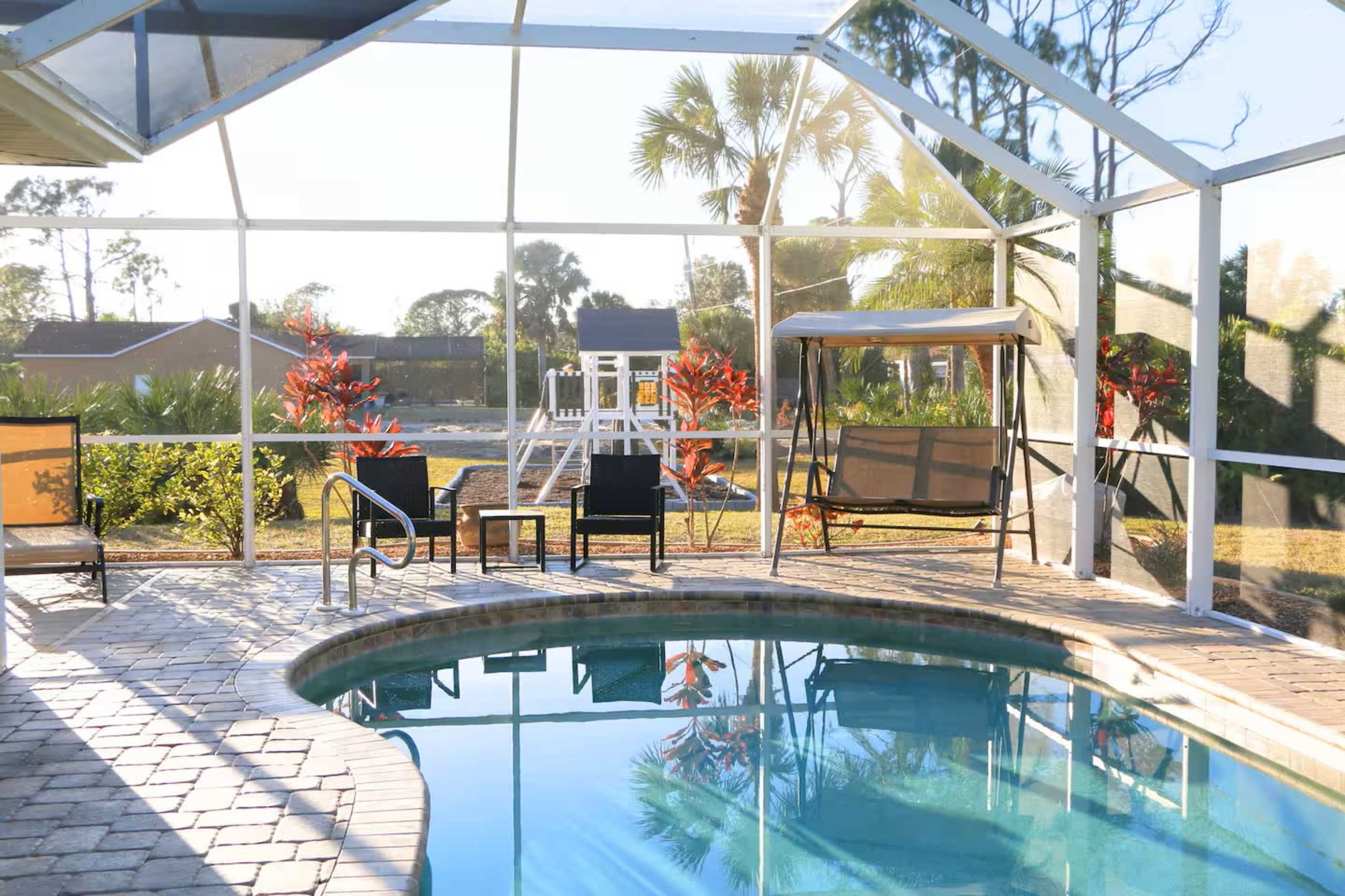 Quaint Florida casita on a double lot with a heated saltwater pool, massive playground, surrounded by Mother nature! Image in Englewood East, Port Charlotte, FL