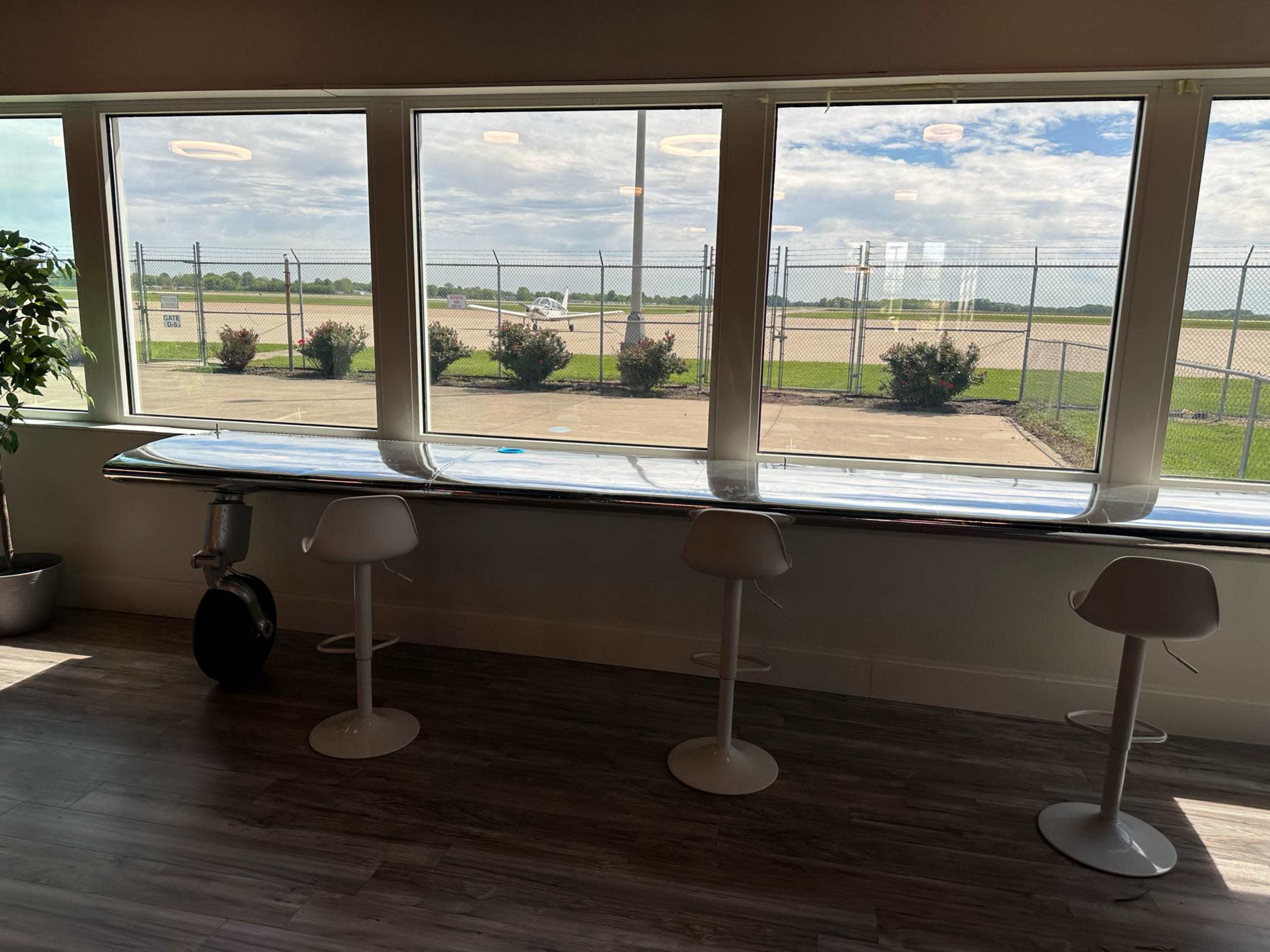 Modern Aviation Lounge with Runway Views + Retro Arcade Vibe Image in Wood River Township, East Alton, IL