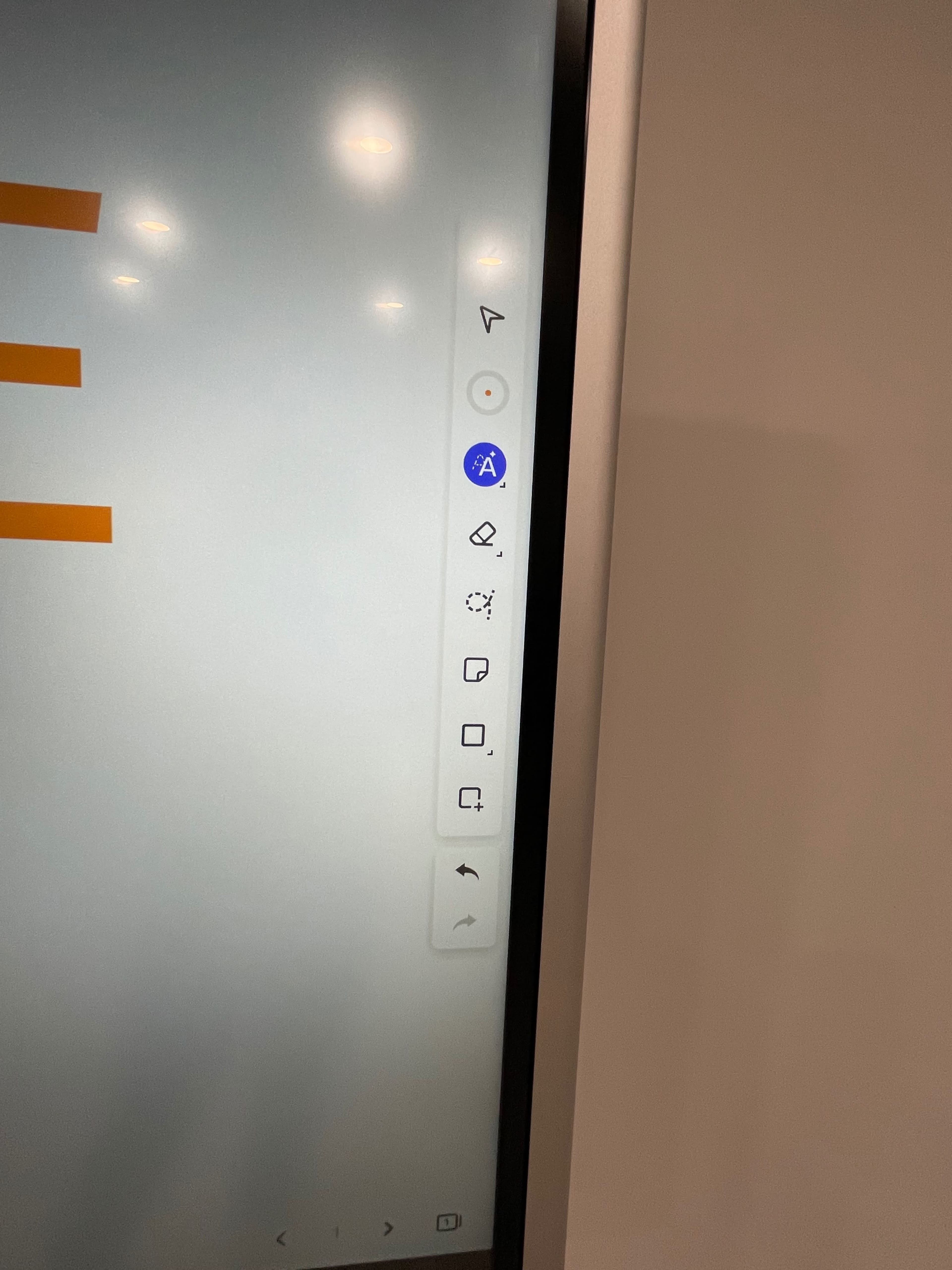 The edge of a touchscreen display with various application icons visible on the left side.