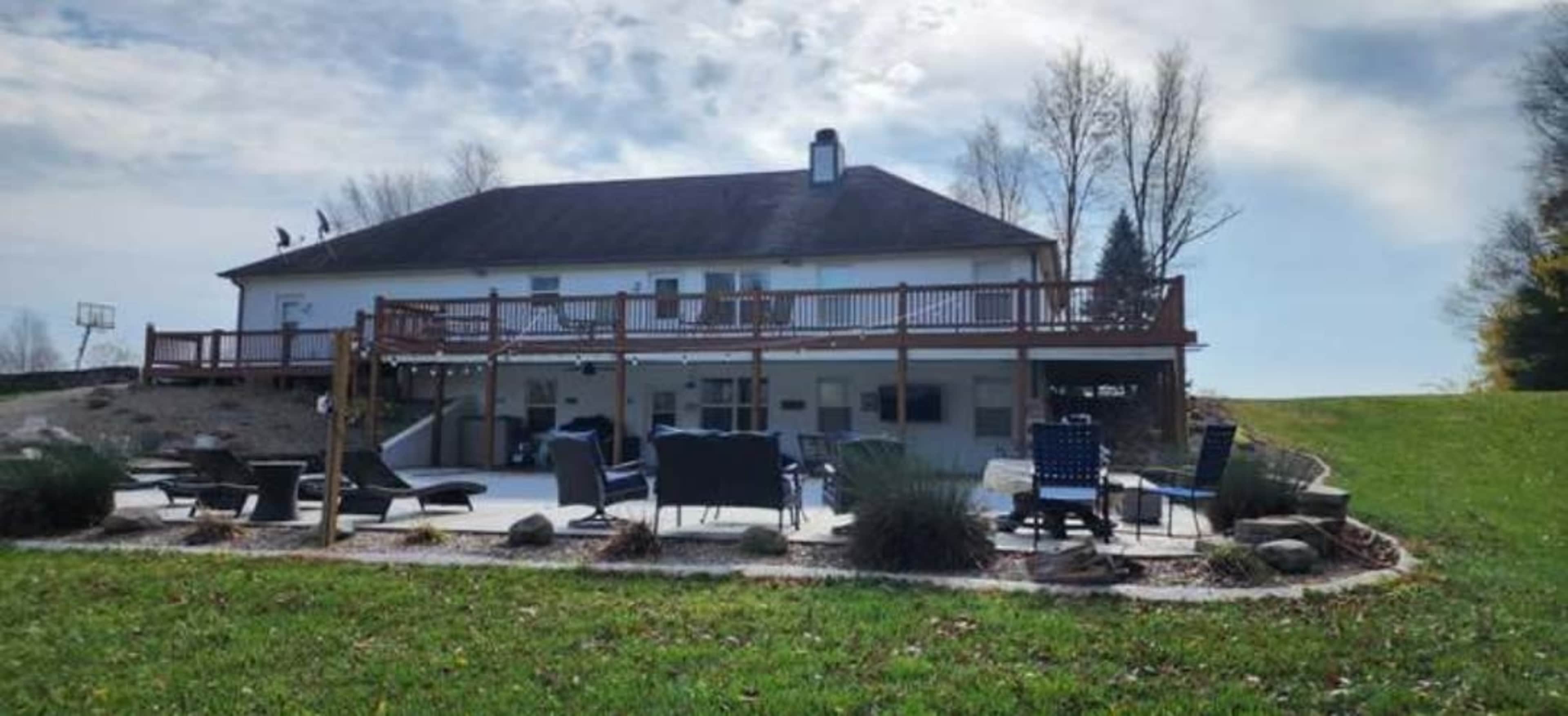 Beautiful farmhouse setting with huge inground pool with walkout basement. Image in Clark Township, Greenwood, IN
