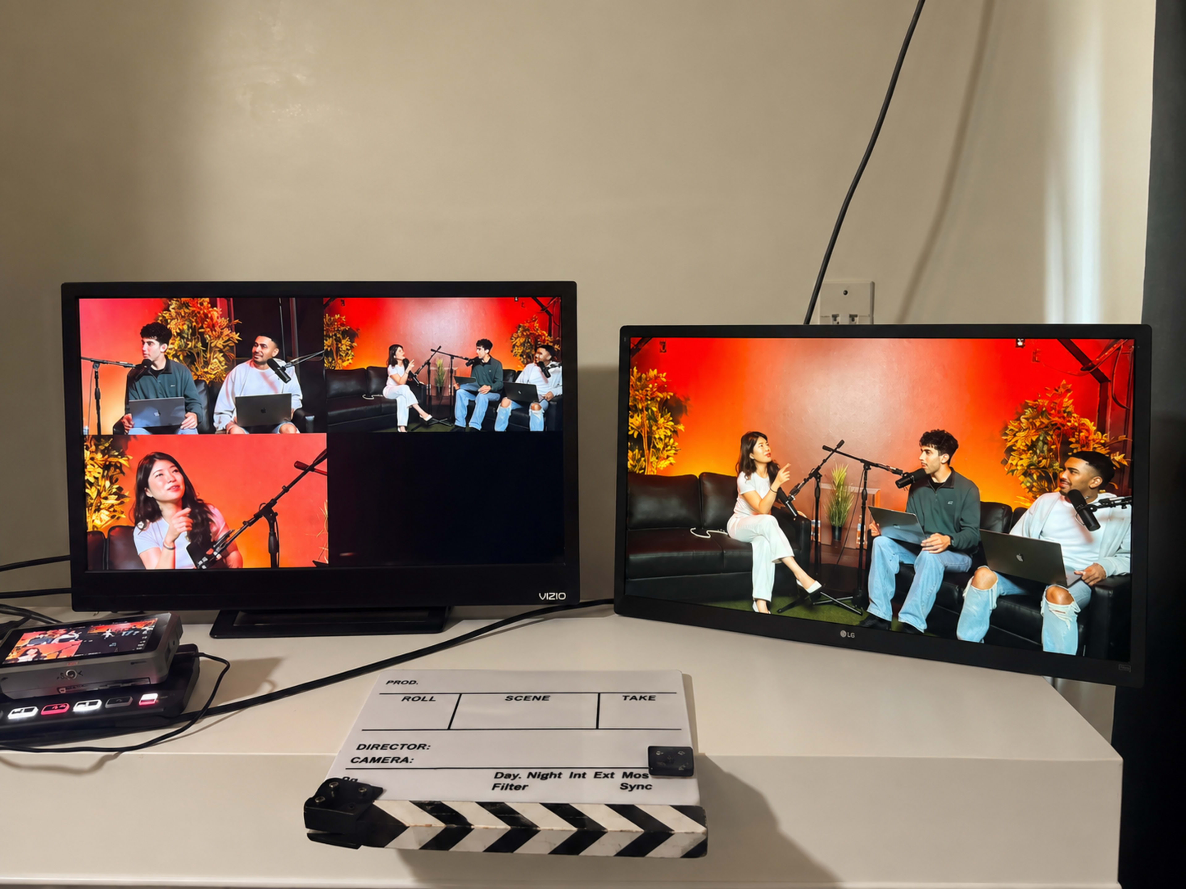 The image shows two screens displaying a video production setup featuring three people sitting on a couch and a camera on a clapperboard.