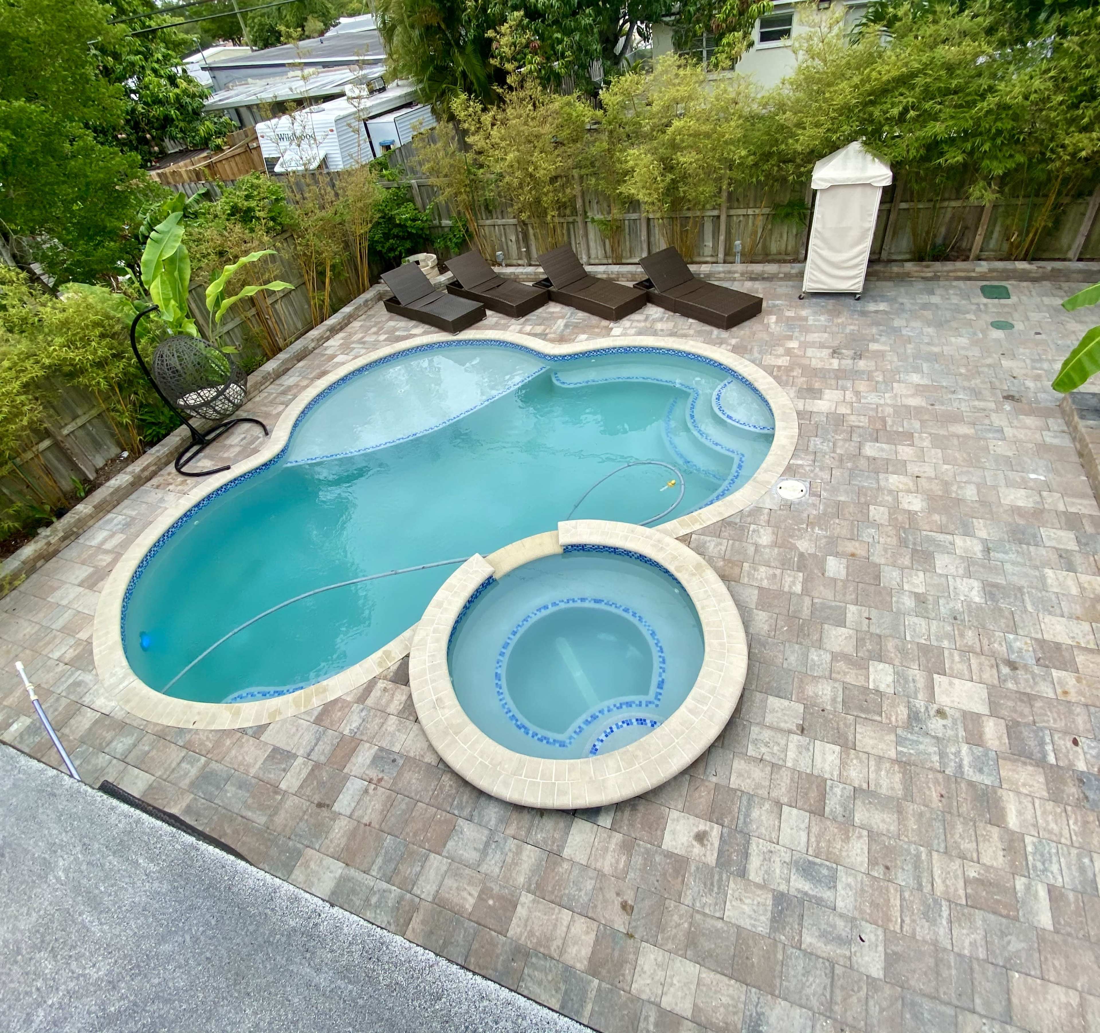 North Miami backyard Pool and hot tub Oasis. Image in North Miami, North Miami, FL