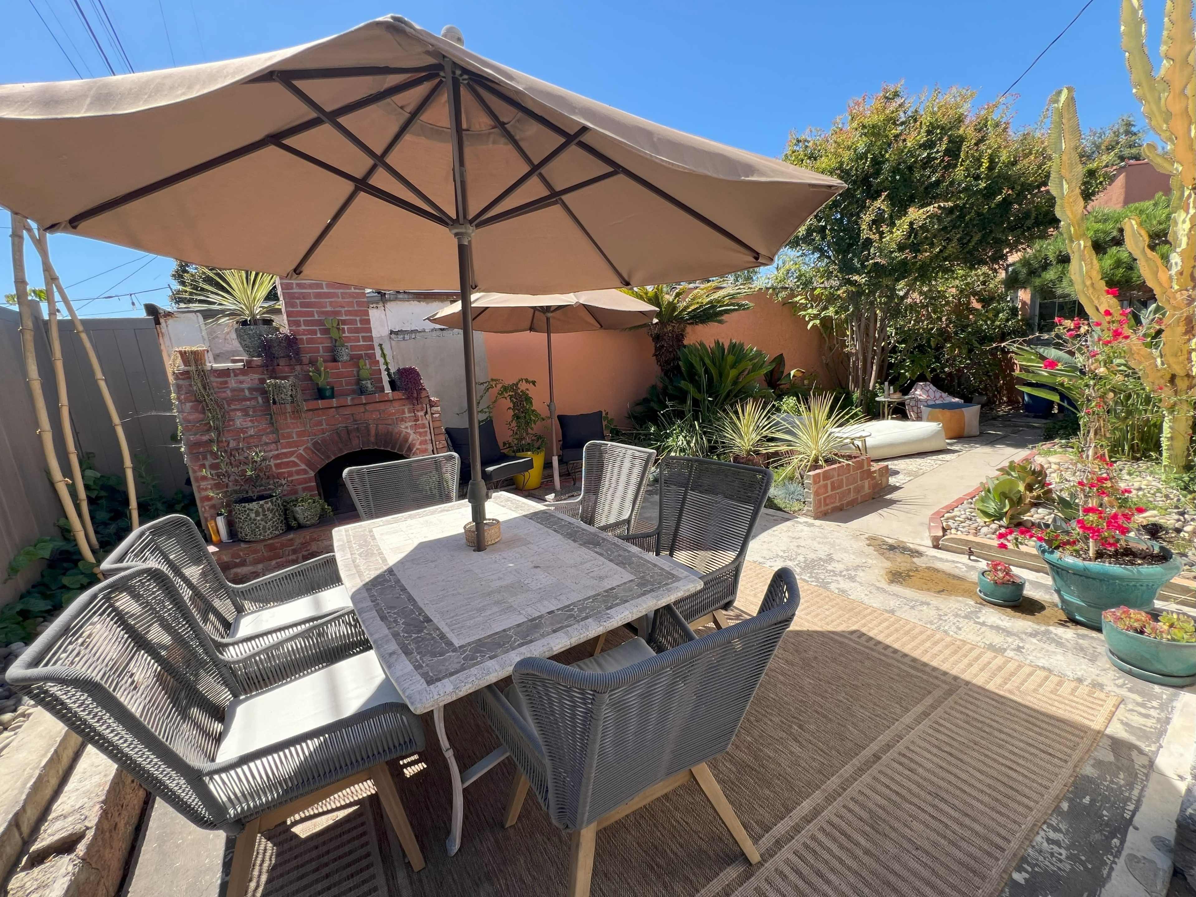 Charming Spanish-Style Backyard with Lush Garden & Private Nooks Image in Hyde Park, Los Angeles, CA