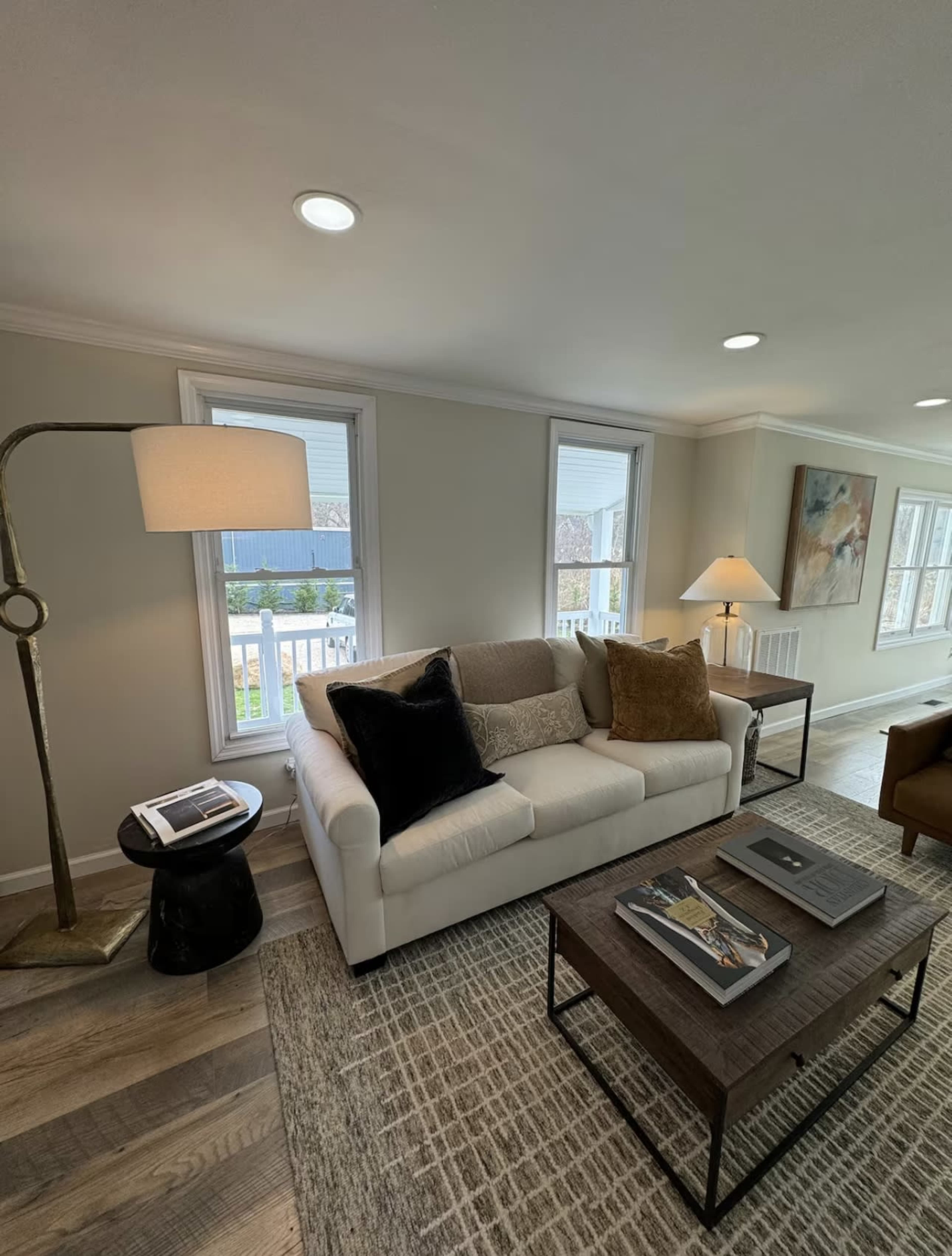 Modern farmhouse with a water view and pool on half an acre property Image in Riverhead, Wading River, NY