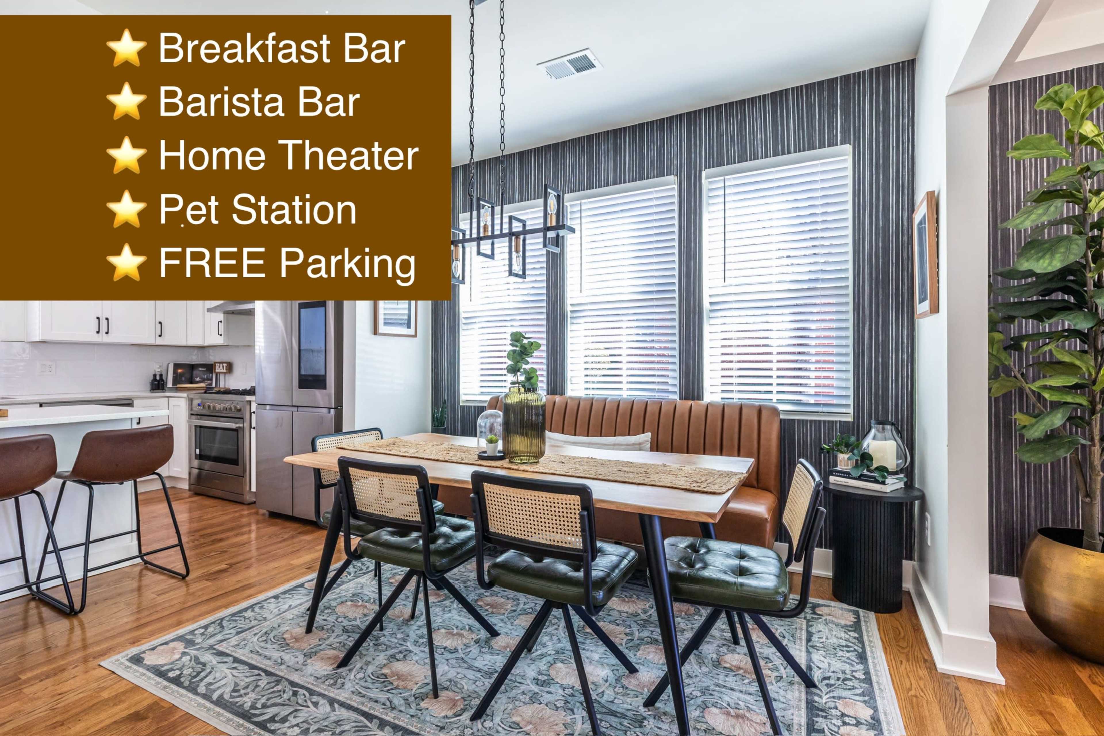 The image shows a modern dining area with a long table surrounded by chairs, a bar area in the background, and large windows allowing natural light to enter the space.