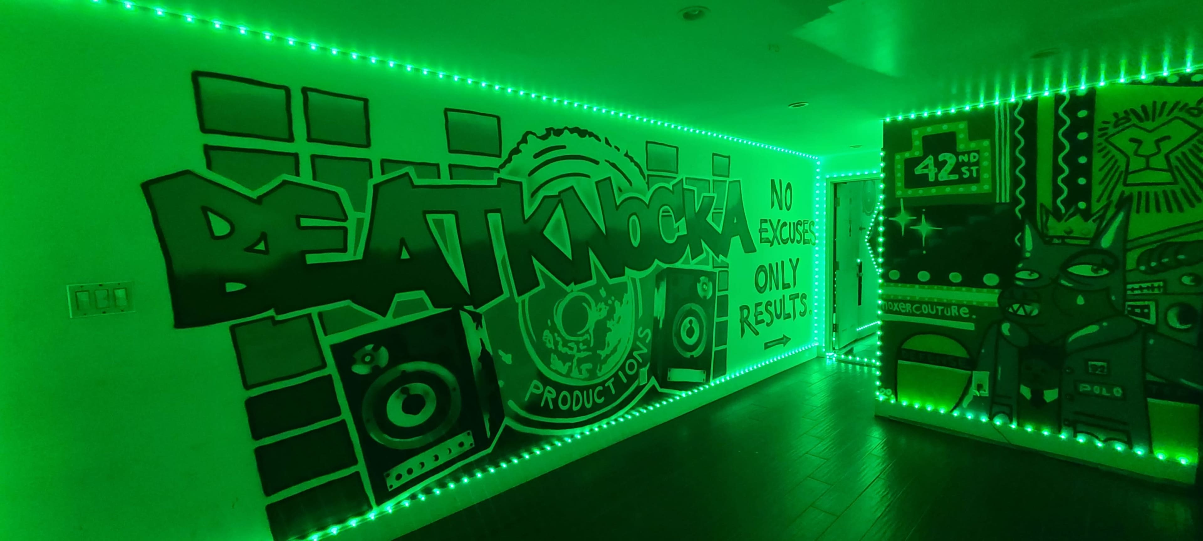 A green-lit hallway adorned with graffiti-style artwork and the text "BEATKNOCK Production" along one wall.
