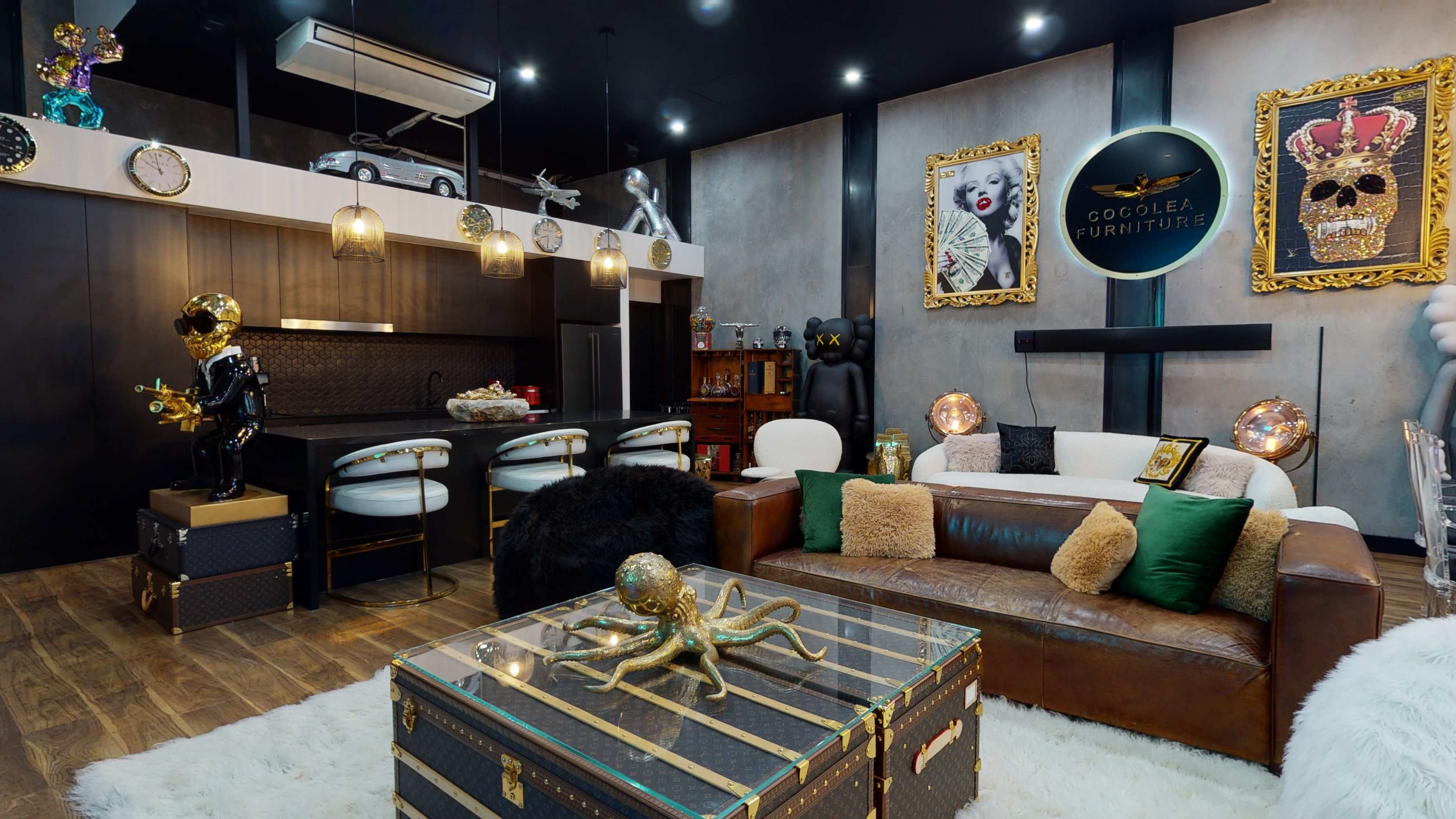 The image shows a stylish living room featuring modern furniture, decorative art pieces, and a large coffee table with an octopus sculpture.