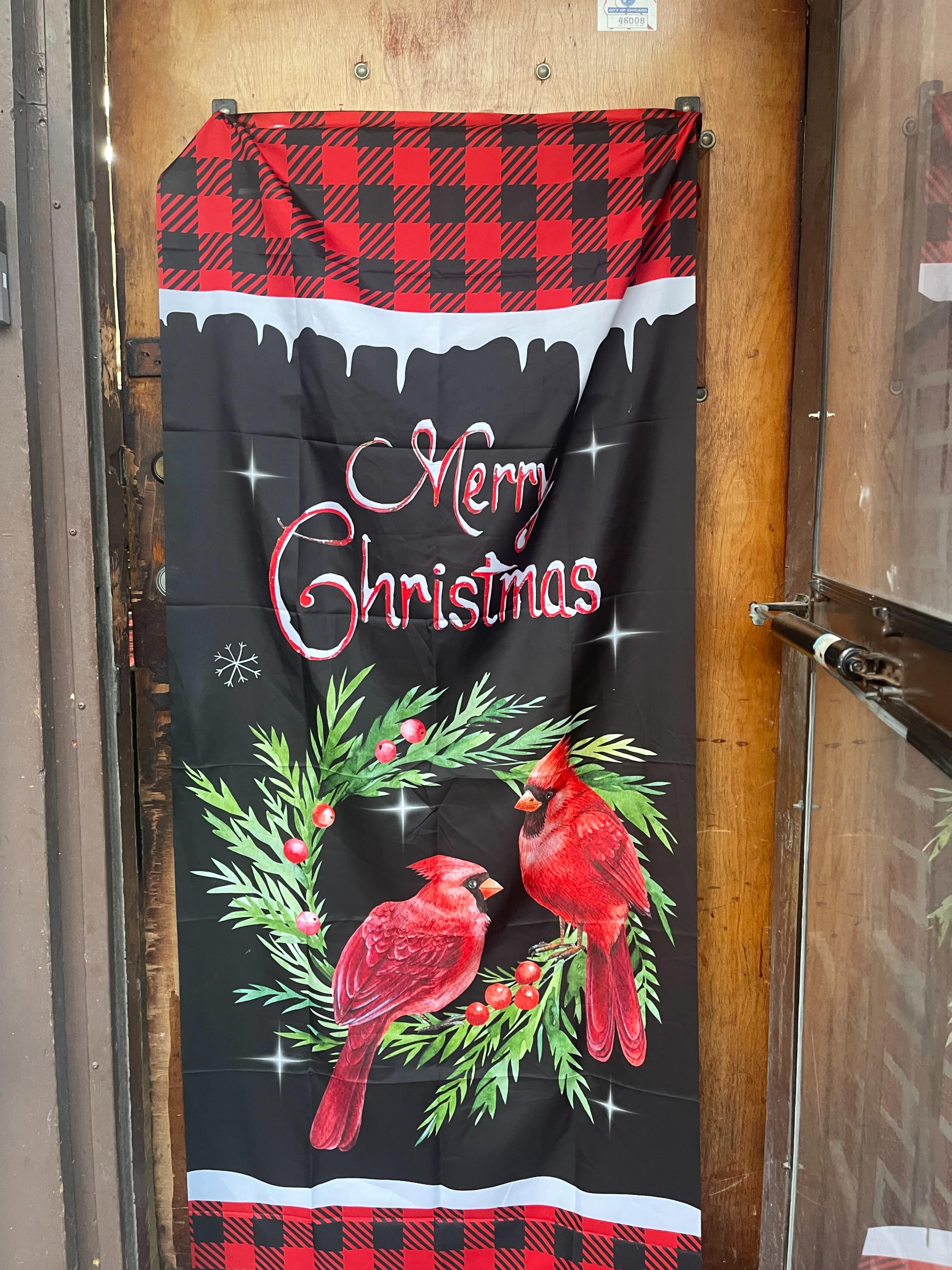The image shows a Christmas-themed banner featuring two red cardinals and a wreath, with the text "Merry Christmas" in a decorative font.
