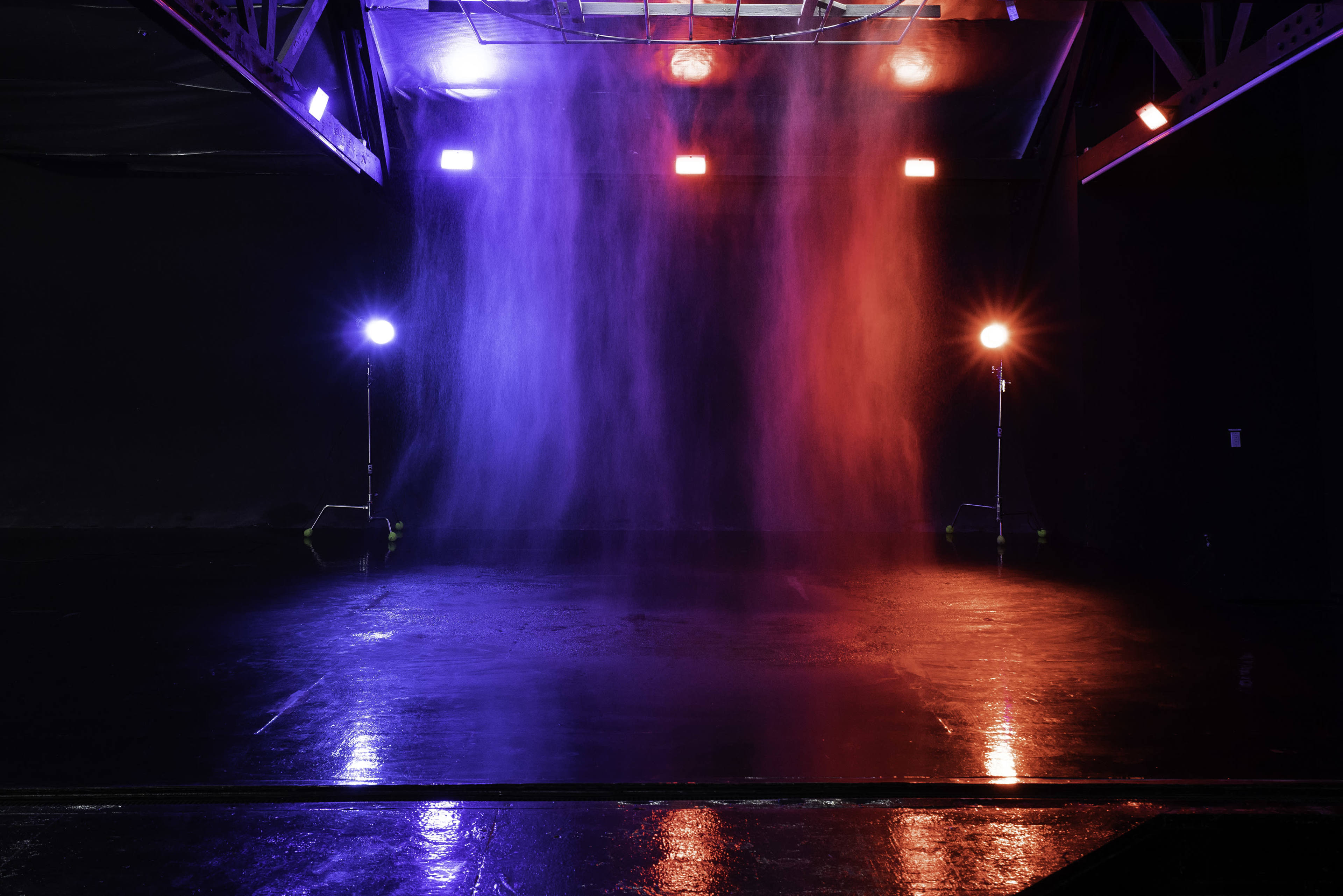 Blackout Car Photo & Video studio with large black cyc wall,  RGB LED Tunnel, rain feature, free parking and roll-up doors - Olympic 2 Image in Boyle Heights, Los Angeles, CA