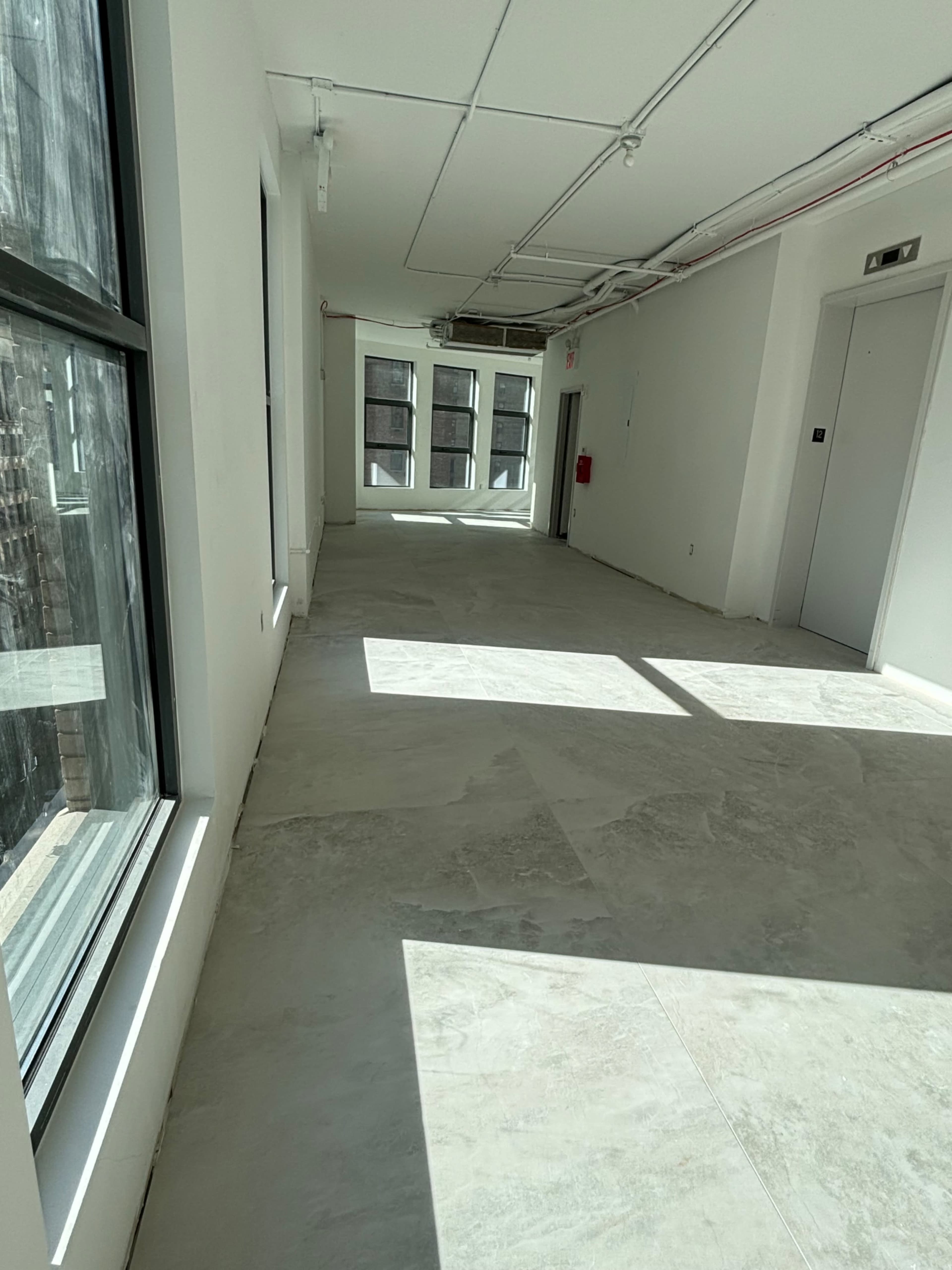 Concrete office space in Nomad; high level w/ multiple windows Image in Midtown Manhattan, New York, NY