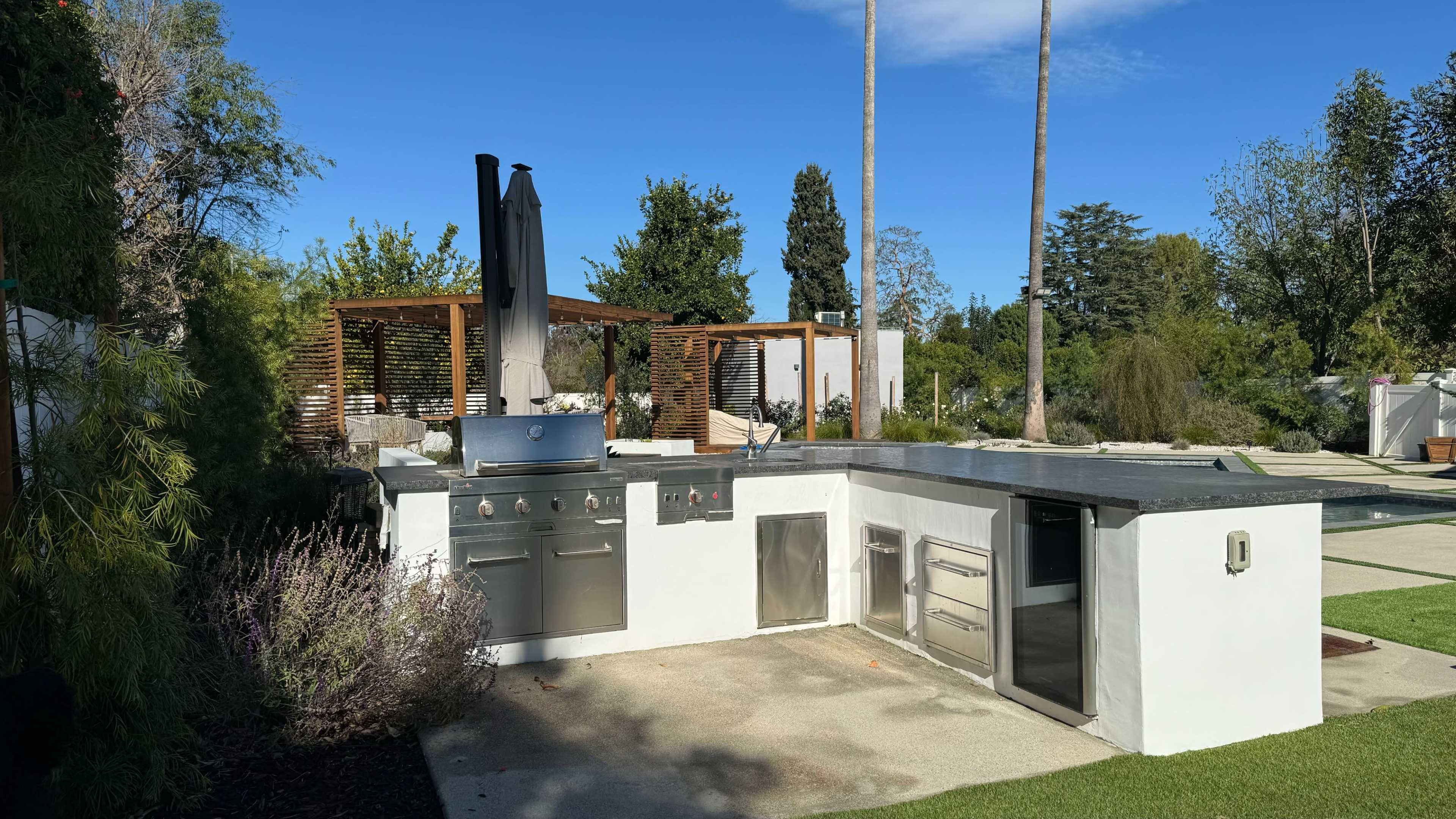 Modern Backyard Oasis with Pool & Outdoor Kitchen Image in Woodland Hills, Woodland Hills, CA