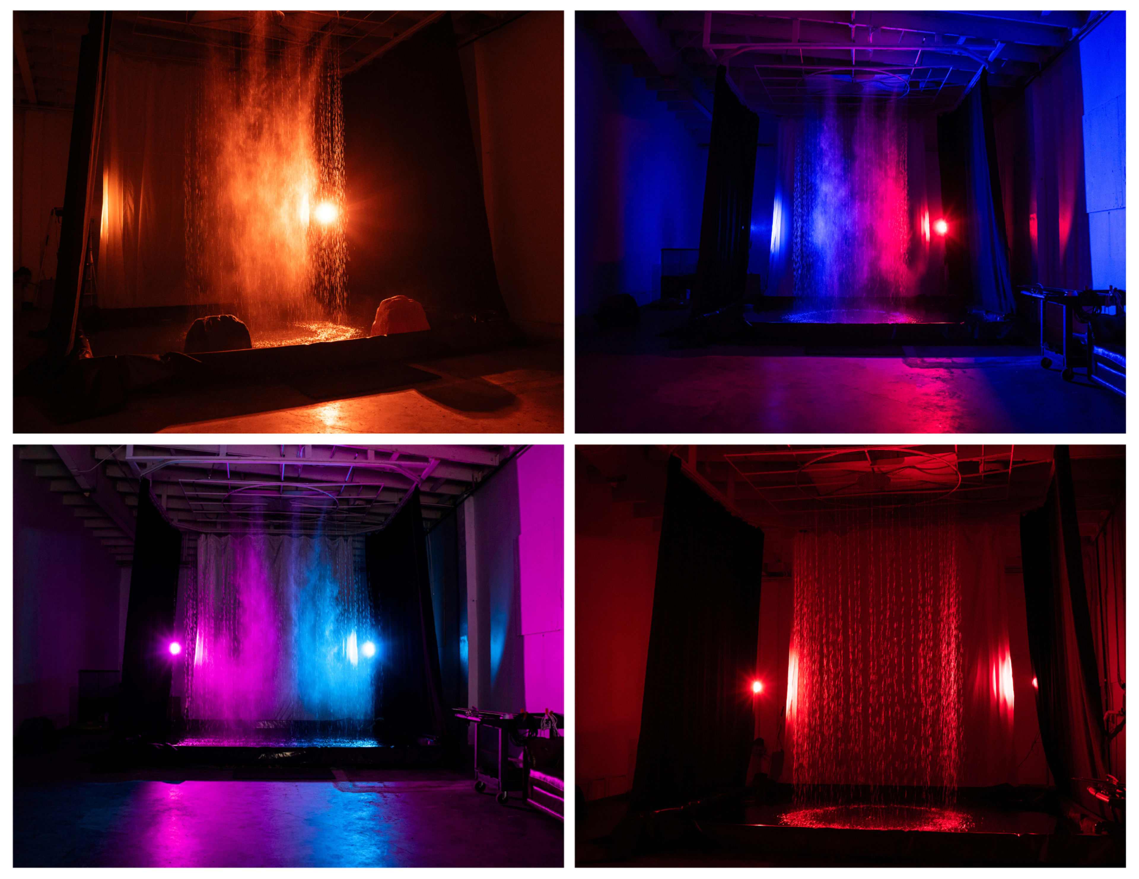 The image displays a large indoor set with a cascading water feature illuminated by various colored lights, creating a dynamic visual effect.