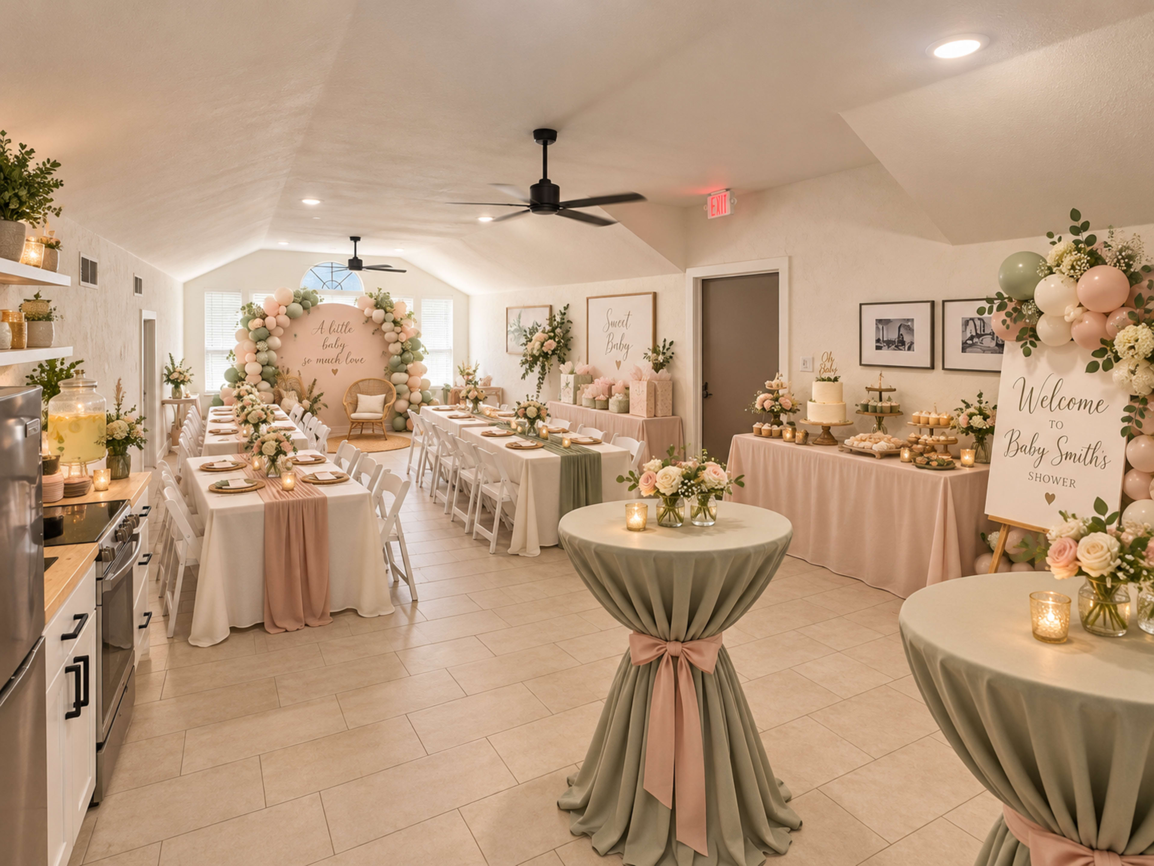 The image shows a decorated indoor space set up for a baby shower, featuring tables with floral centerpieces, balloon arrangements, and a welcome sign.