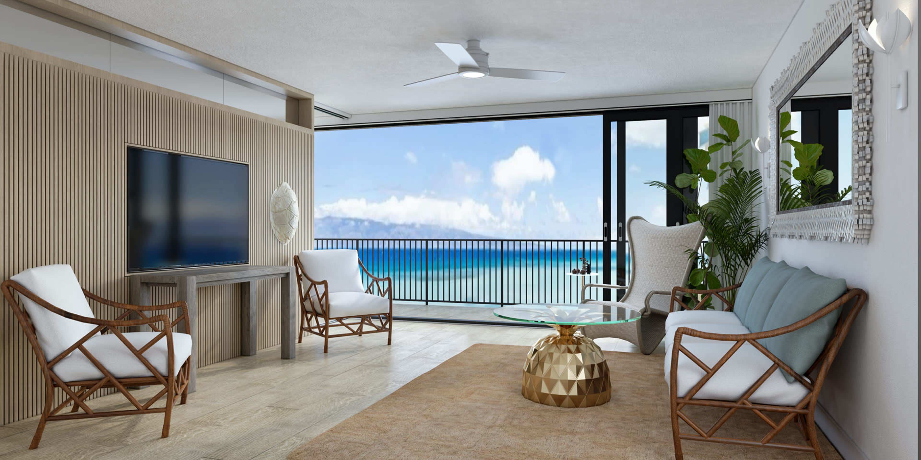 A modern living room features a flat-screen TV, two chairs, a coffee table, and large windows offering a view of the ocean.