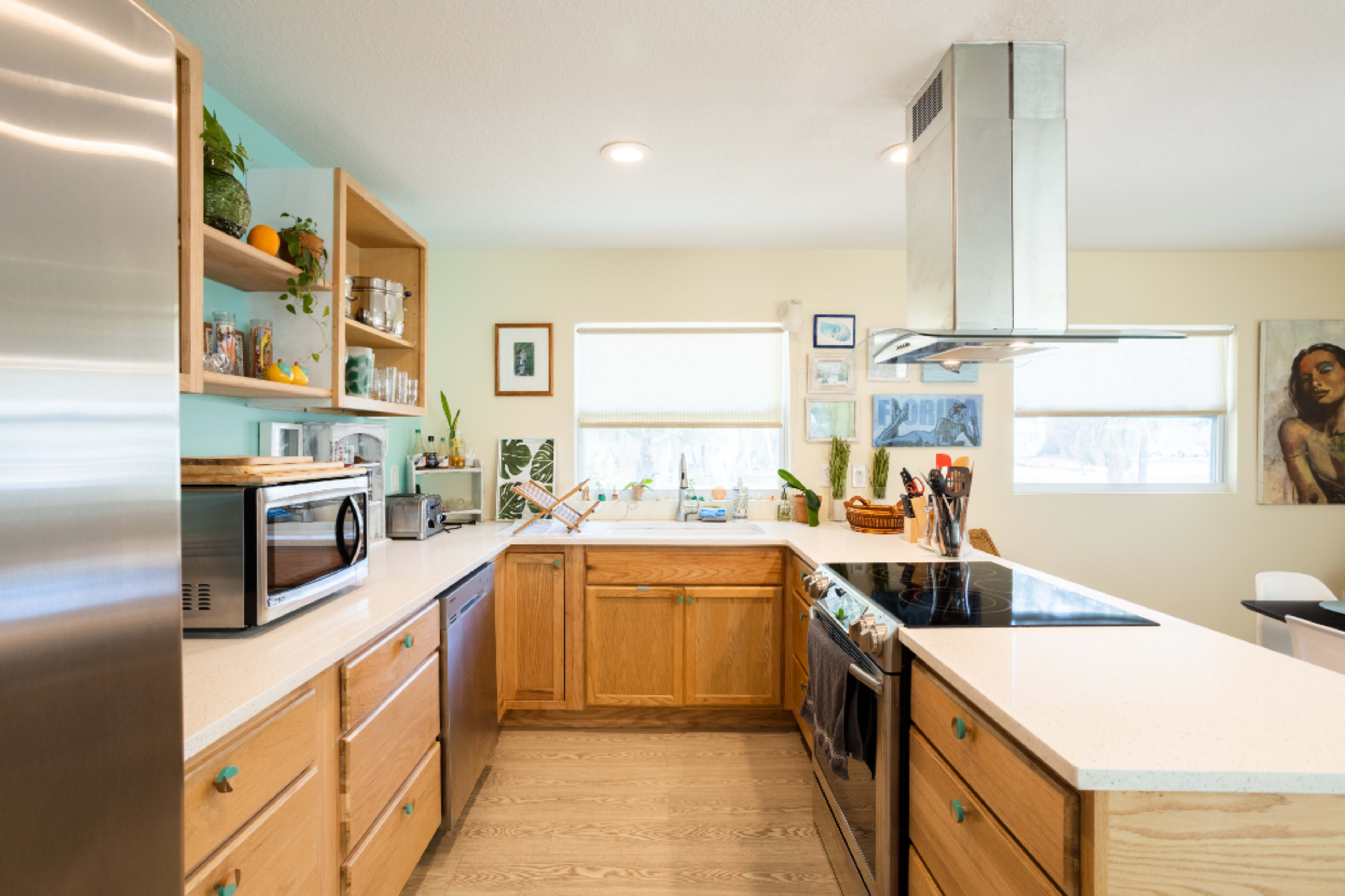 Cheerful downtown home flanked by empty green spaces Image in Gillespie Park, Sarasota, FL