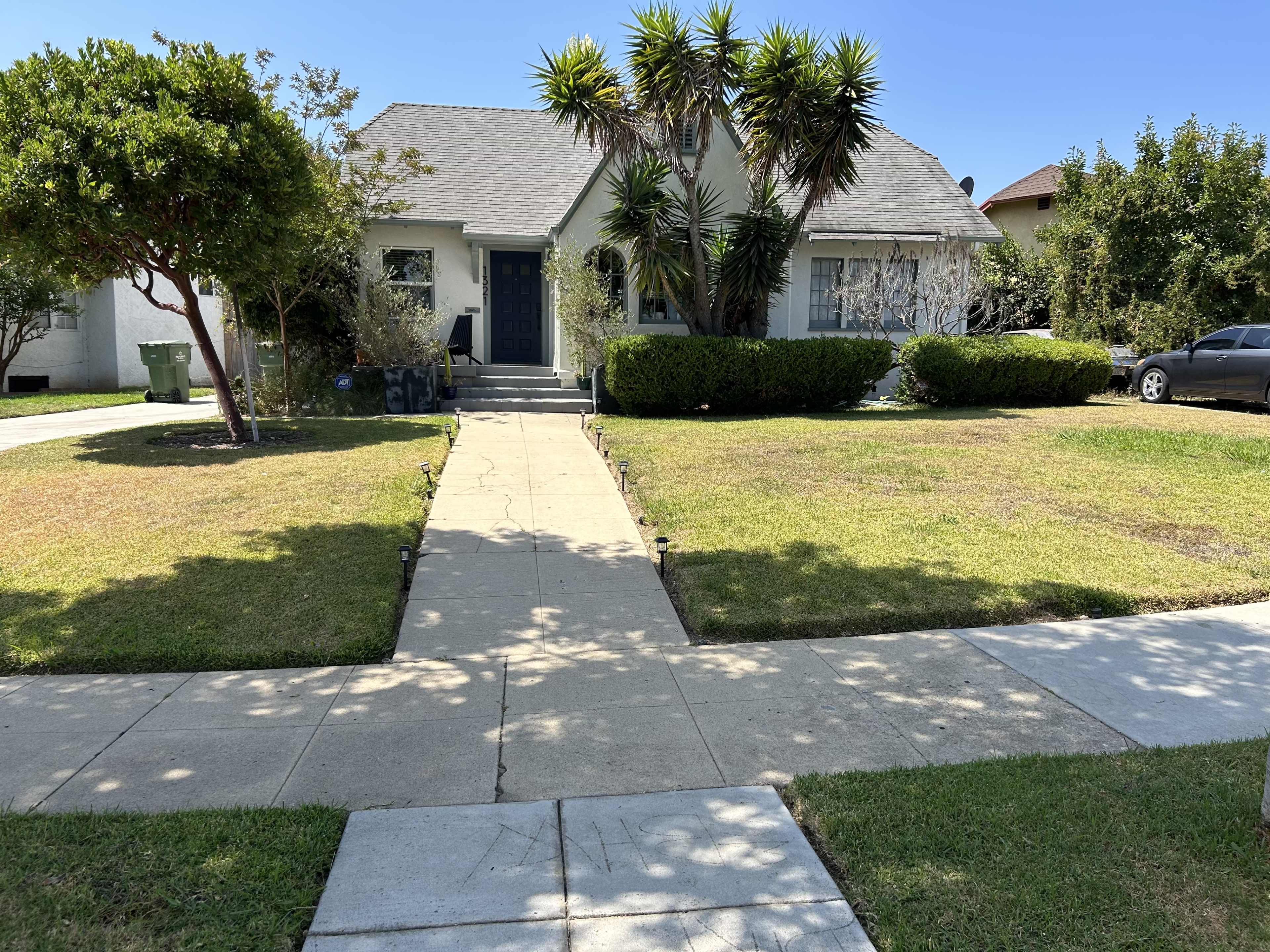 Tudor-style Cottage with Sunlit Patio & Lush Backyard Image in Inglewood, Inglewood, CA