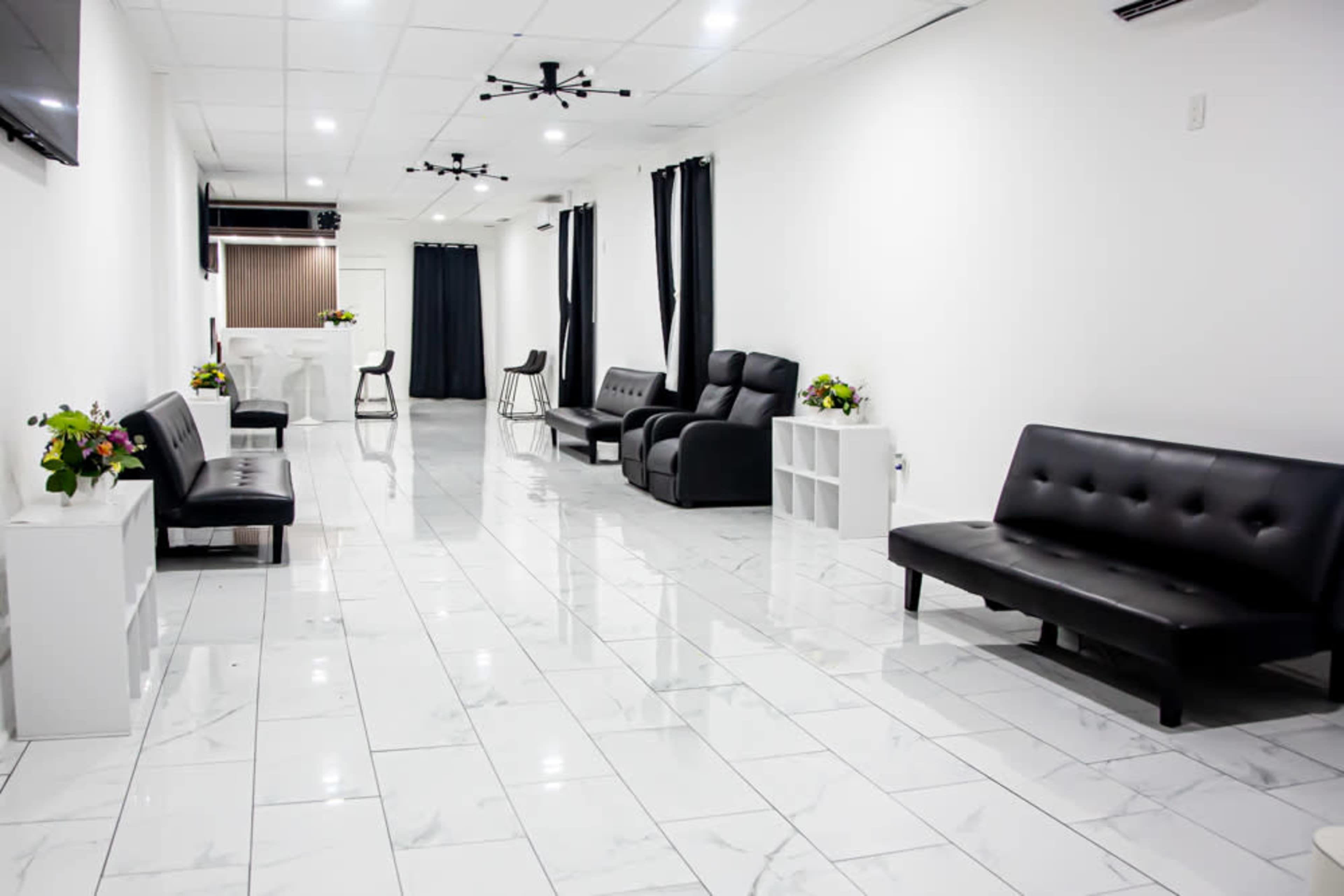 Elegant Black & White Space with Marble Floors and a Wood-Finished Bar Image in Hempstead, Baldwin, NY