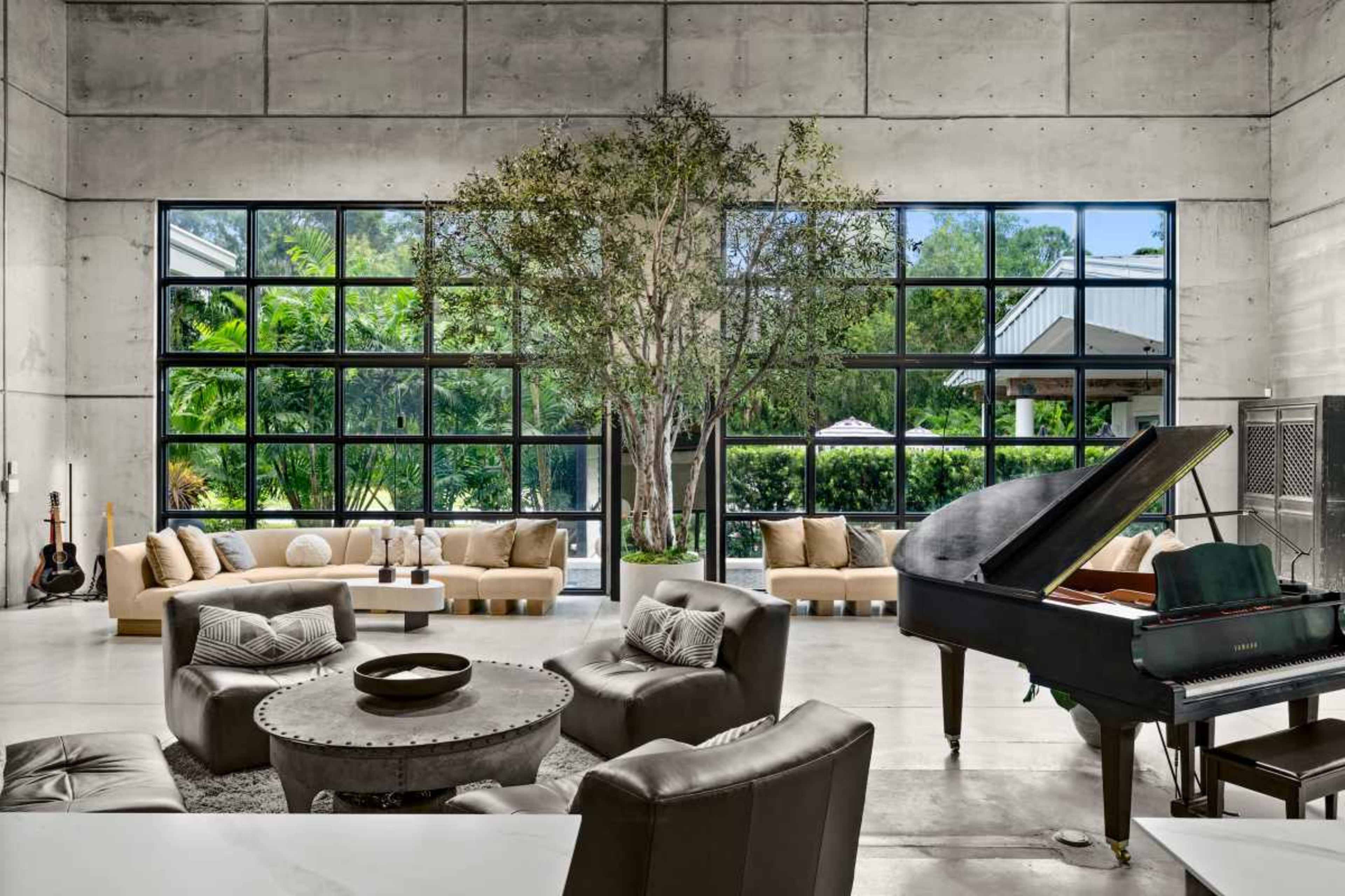 2.5-Acre Estate w/ Cinema, Gym, Pool, Pickle Ball, Hot Tub, Cat Walk, Pool Table - Industrial Modern Aesthetic Image in Urban Estates, Naples, FL