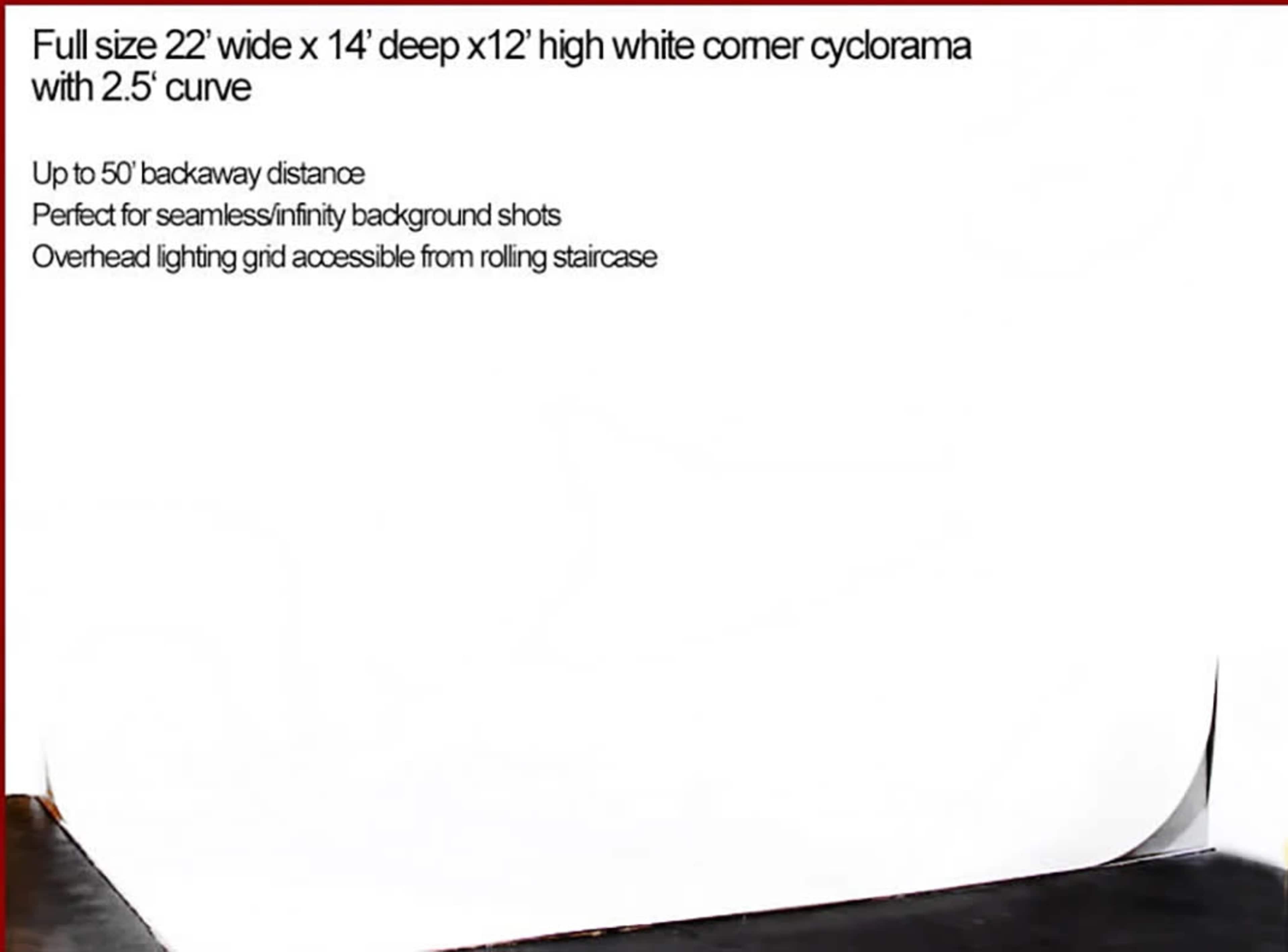 A white corner cyclorama backdrop measuring 22 feet wide, 14 feet deep, and 12 feet high, with a 2.5-foot curve at the bottom.