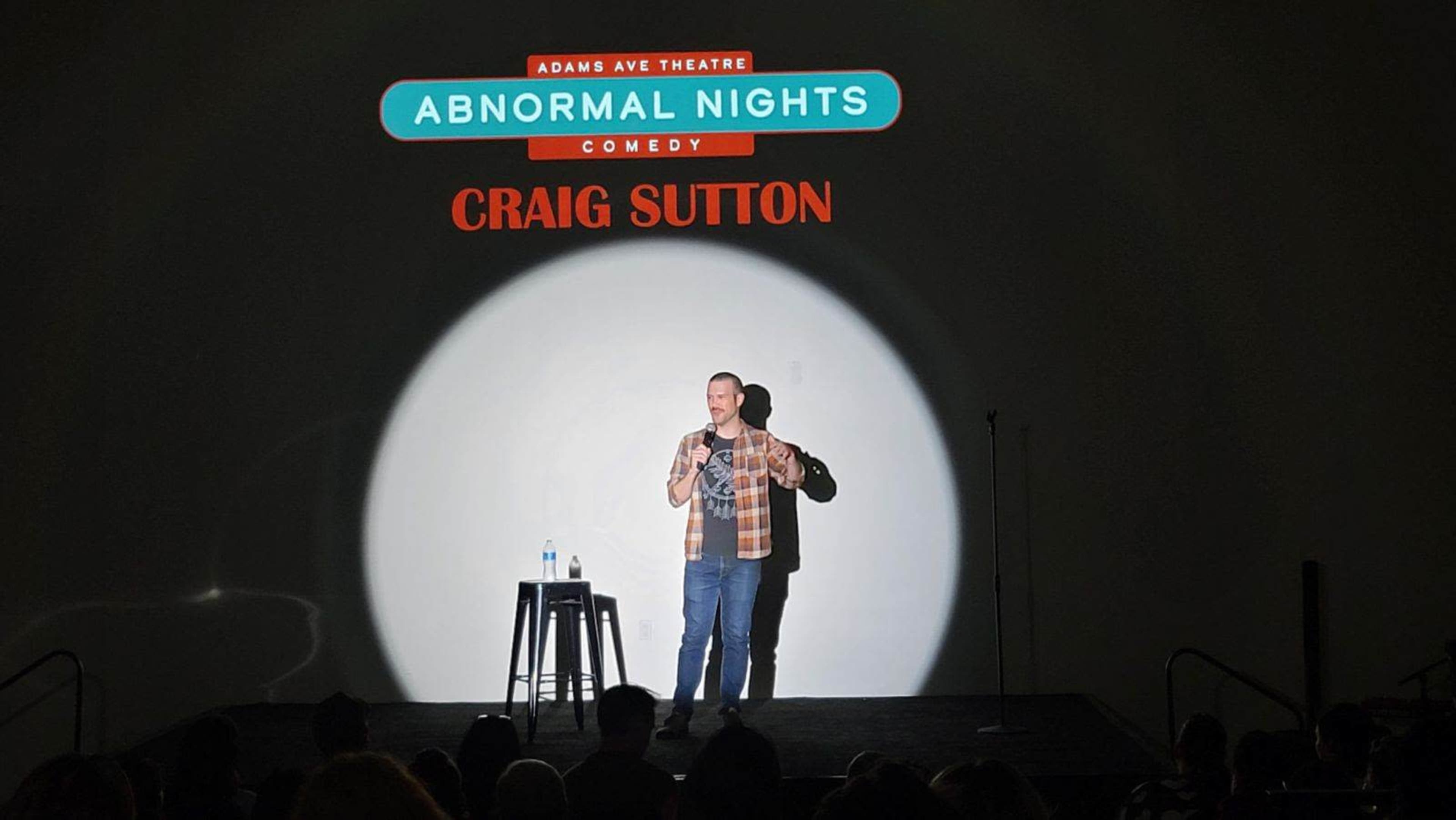 A comedian performs on stage at Adams Ave Theatre during an event titled "Abnormal Nights" featuring Craig Sutton.
