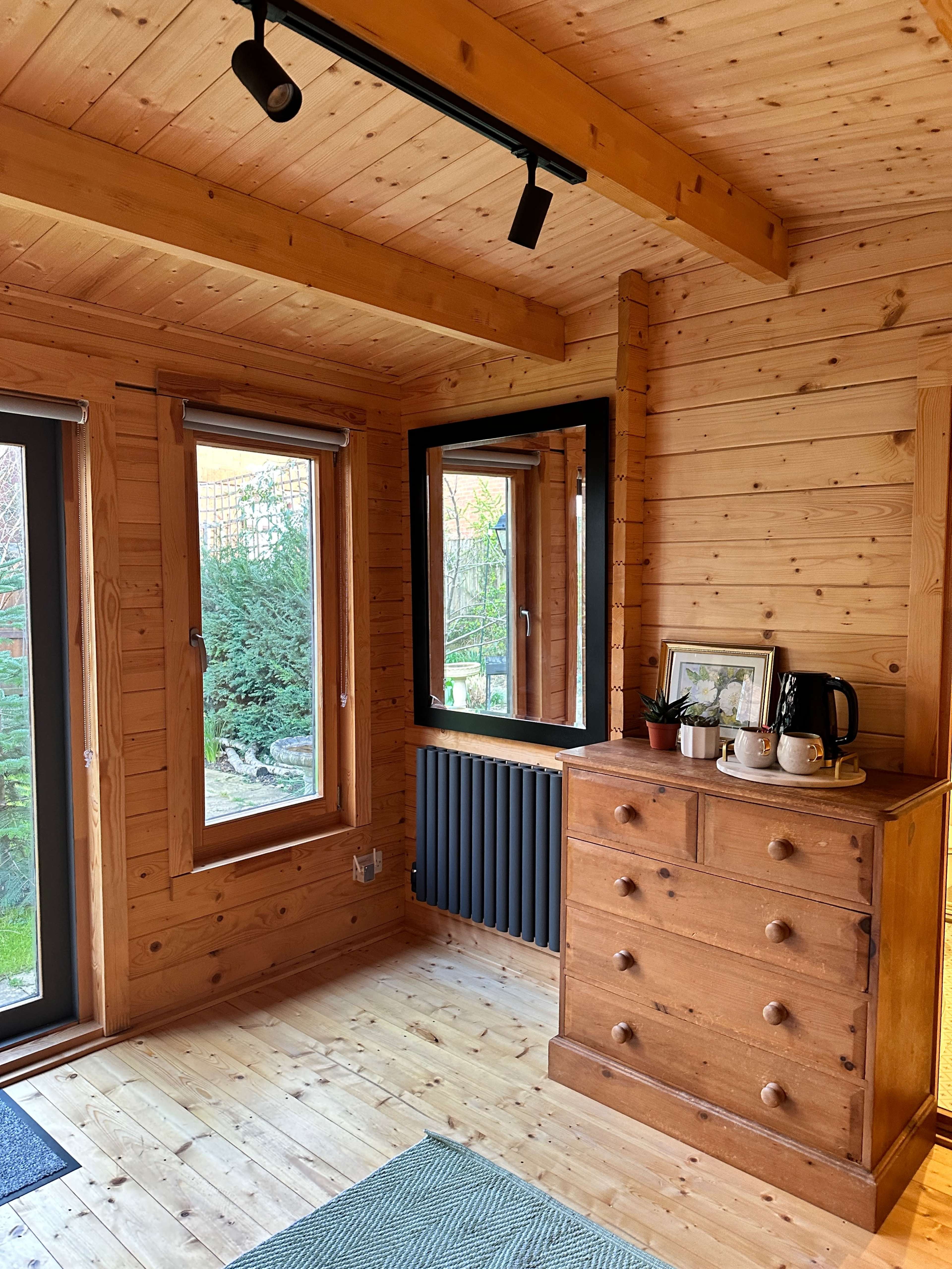 light-filled log cabin with ensuite bathroom Image in Raynes Park, london, ENG