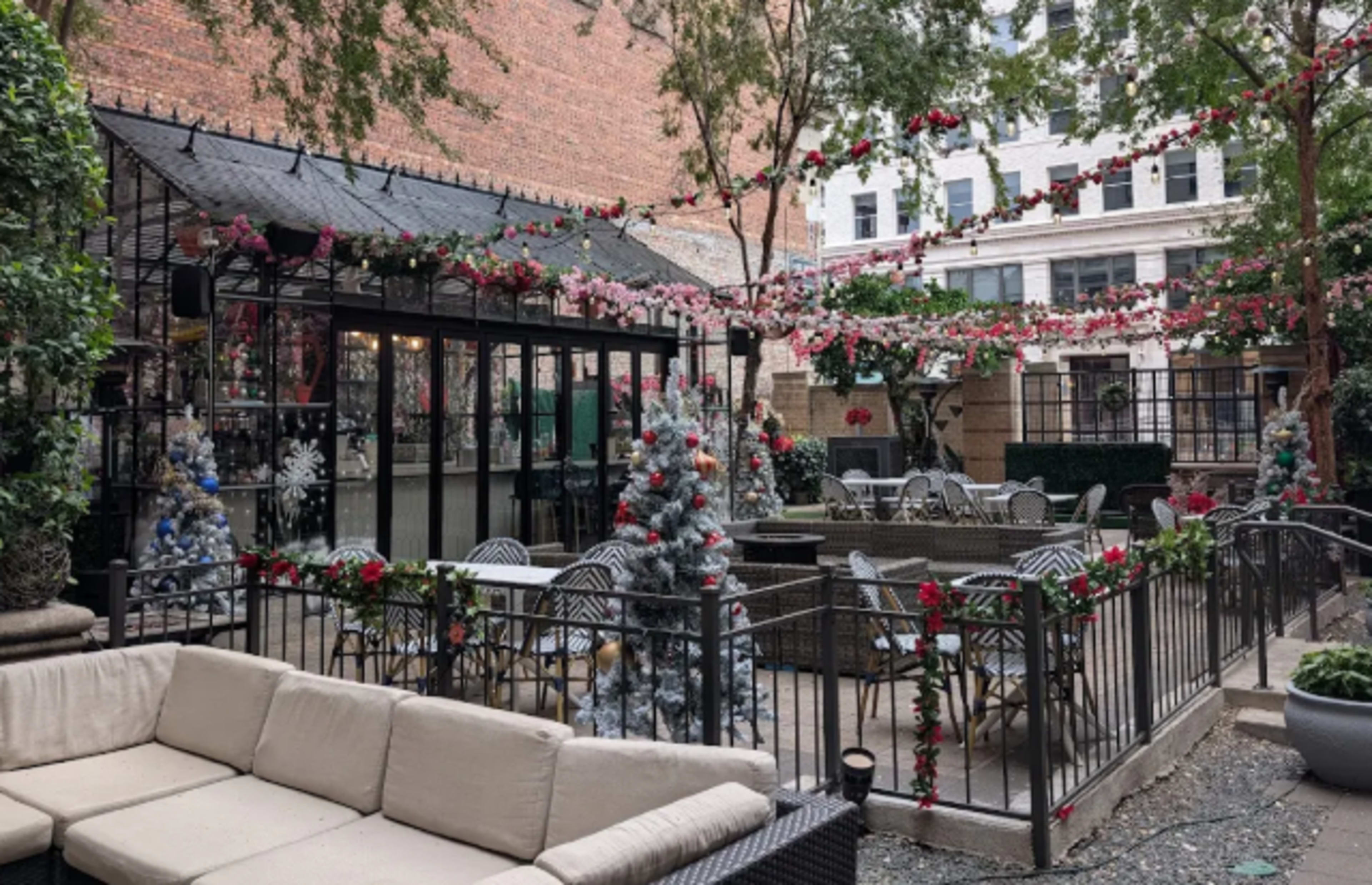 Soho Garden Downtown Houston open patio cocktail bar on Main st