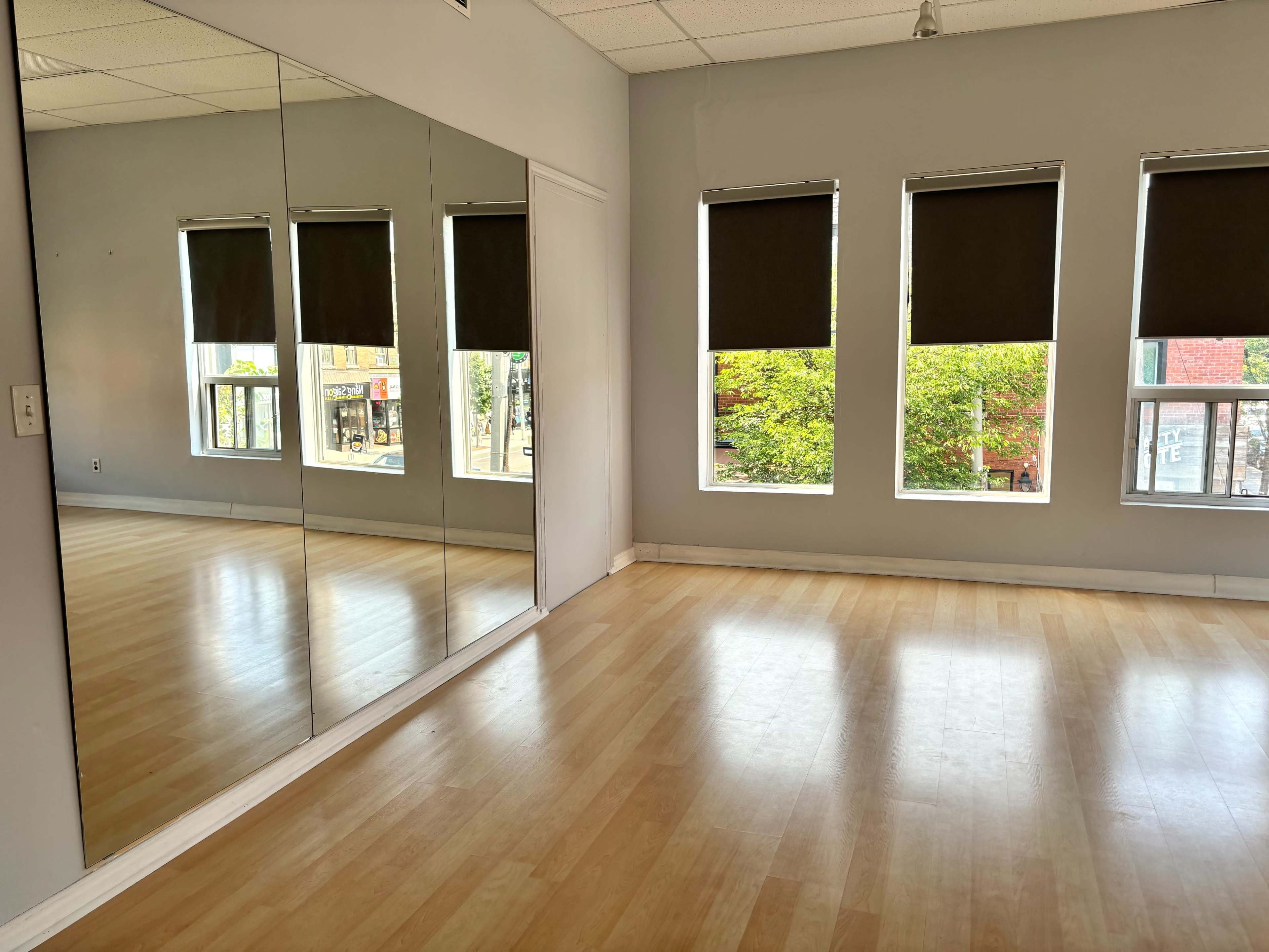 Sunny Dance & Yoga Studio with Ombré Curtains | Natural Light Haven Image in Harbord Village, Toronto, ON