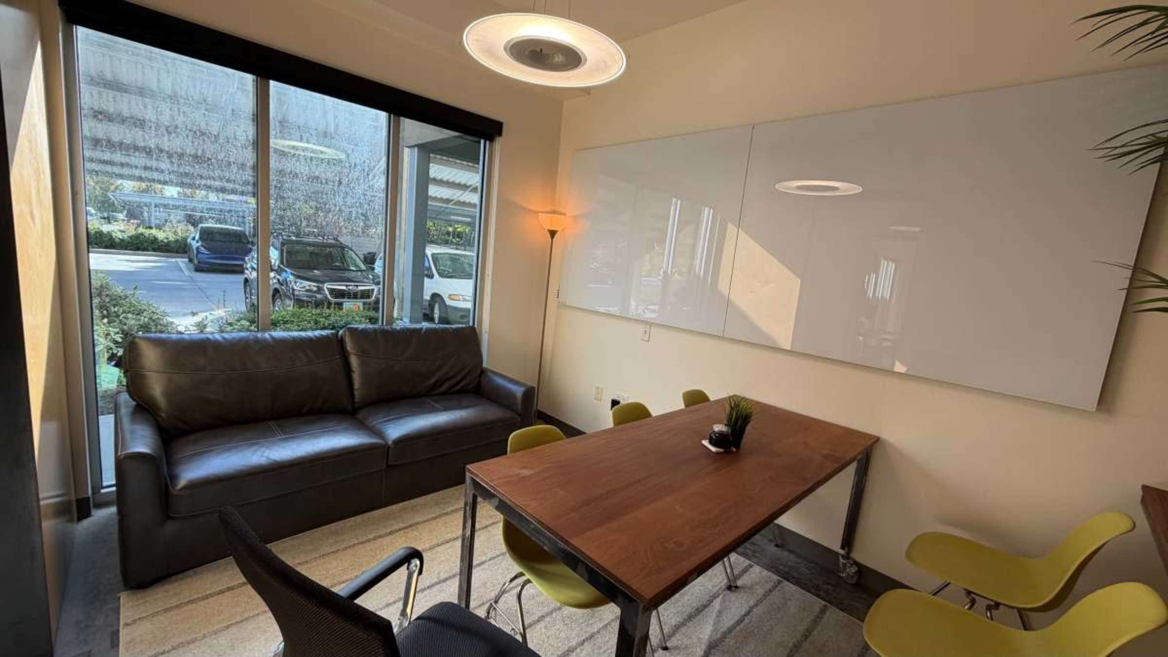 Modern Conference & Creative Meeting Room w/ Huge Glass Whiteboard, TV, & Couch Seating Image in Ballpark, Salt Lake City, UT
