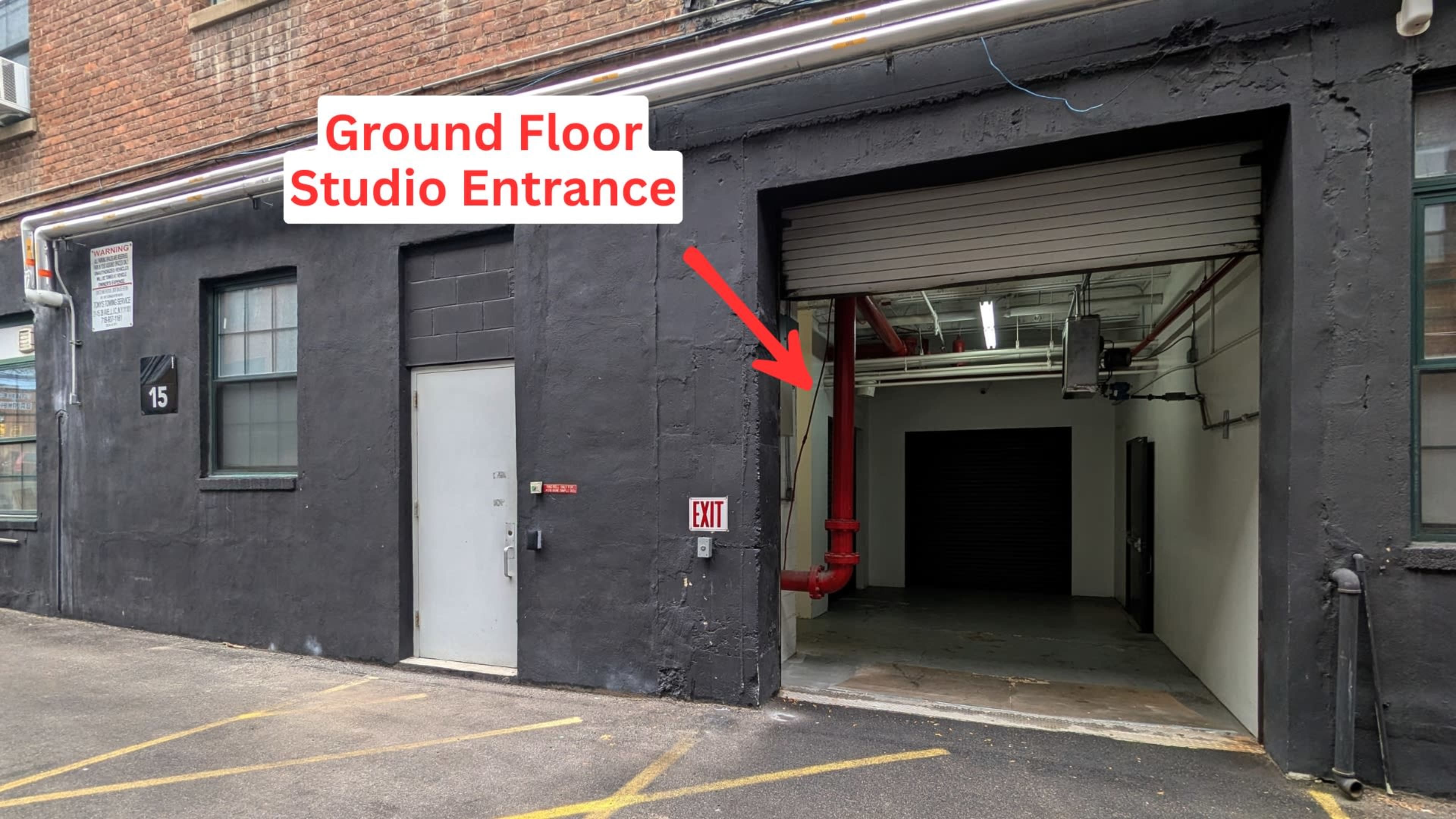 The image shows a ground floor studio entrance highlighted with an arrow and the text "Ground Floor Studio Entrance" on the wall of a building.