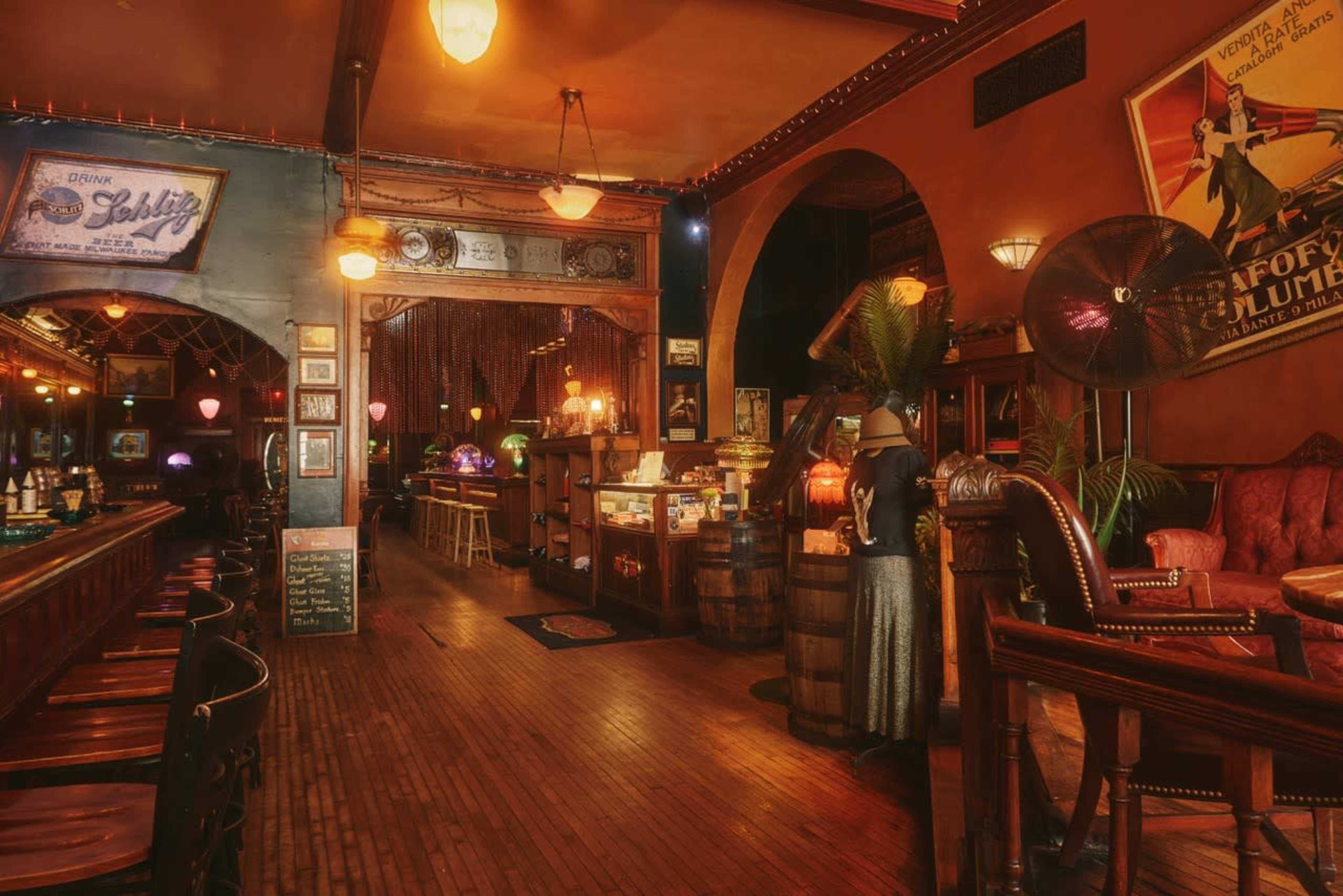 The scene features an old-fashioned bar with wooden furnishings, vintage decor, and dim lighting, creating a nostalgic atmosphere.