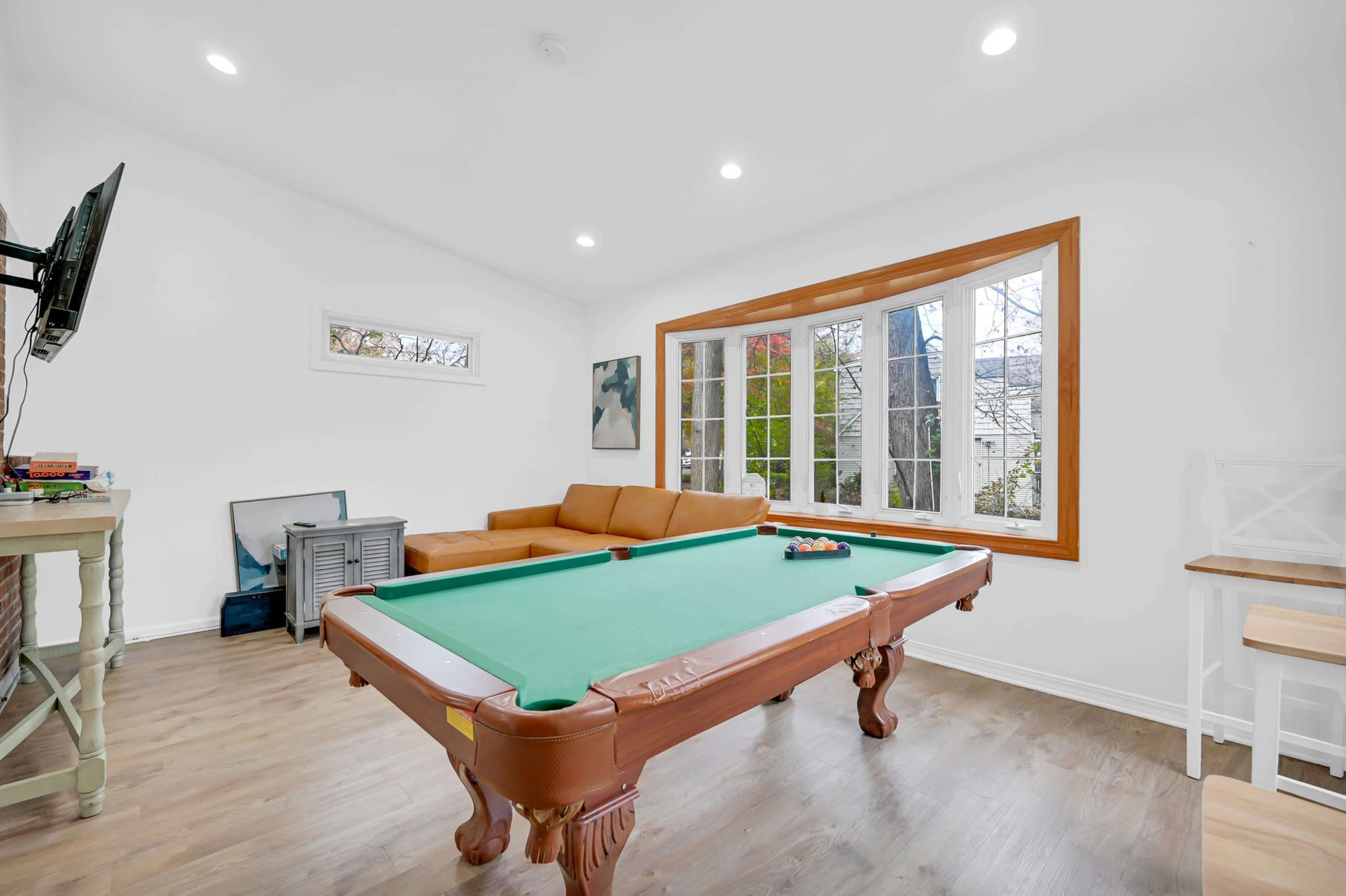 Modern Open Concept Entire single family home with basketball court and full deck in the back yard. Small creek runs as well on side of property. Image in Englewood, Englewood, NJ