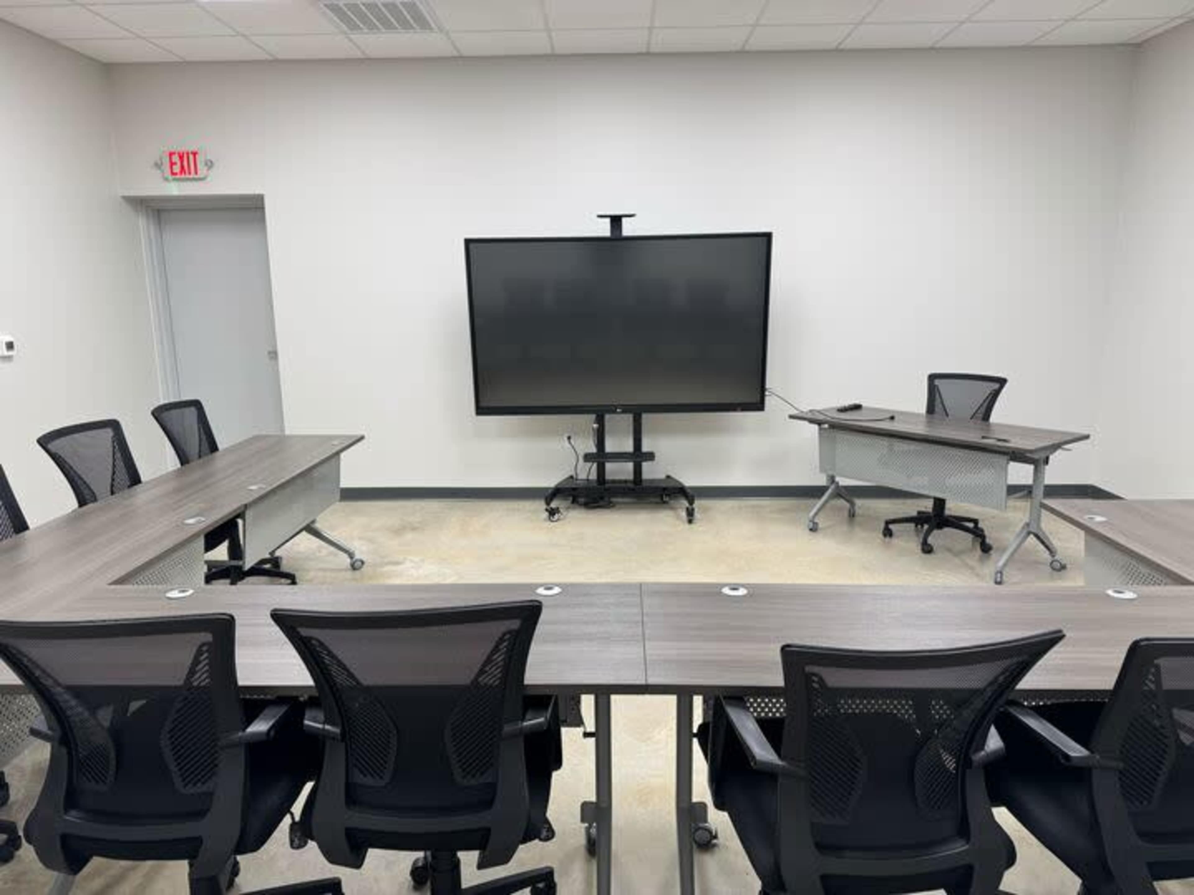 Industrial Boardroom | Seats 12 | 86" Smart Board Image in Conroy Park, Manchaca, TX