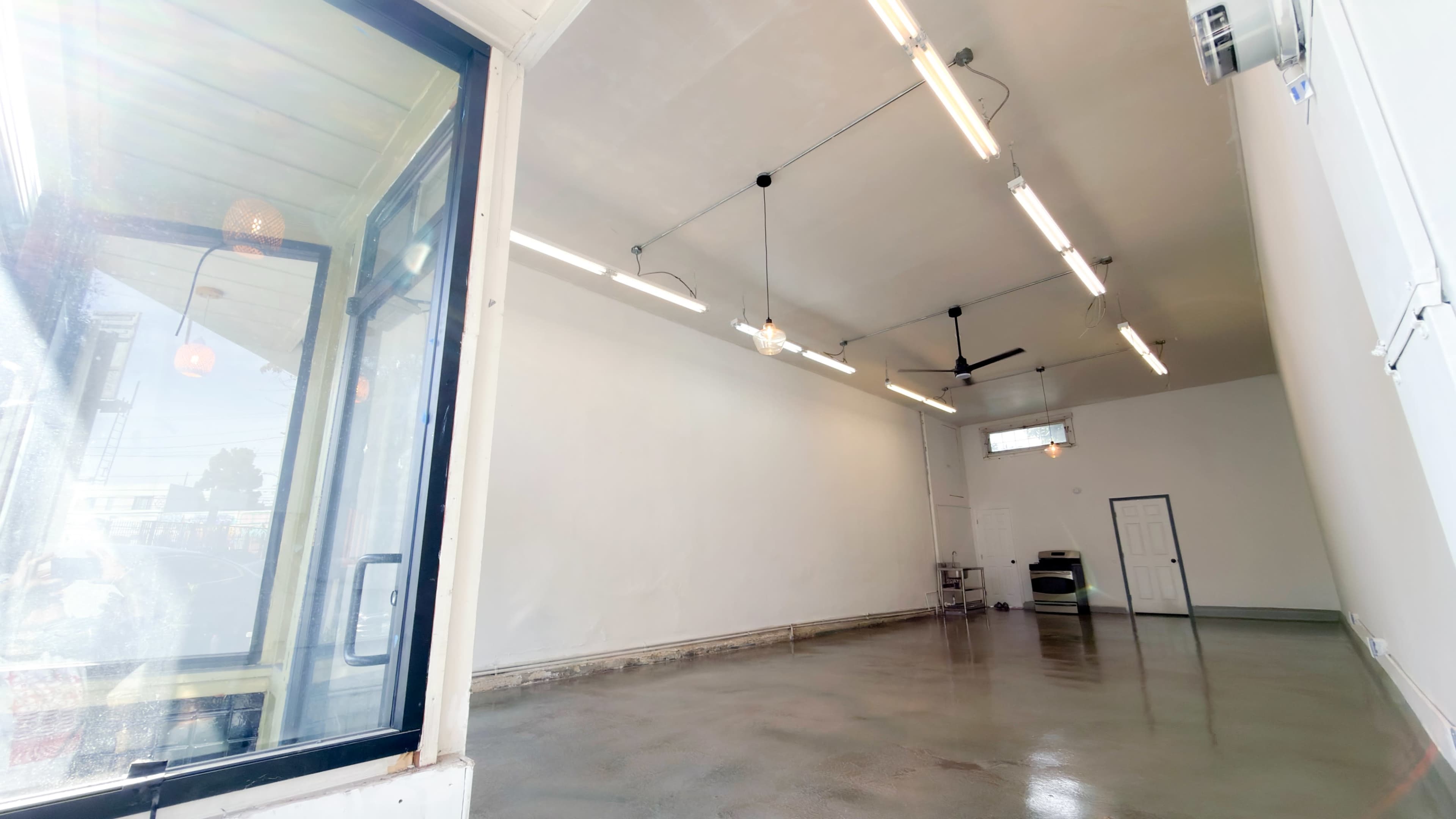 Bright Minimal Storefront Event Space with Polished Concrete Floors Image in , Oakland, CA