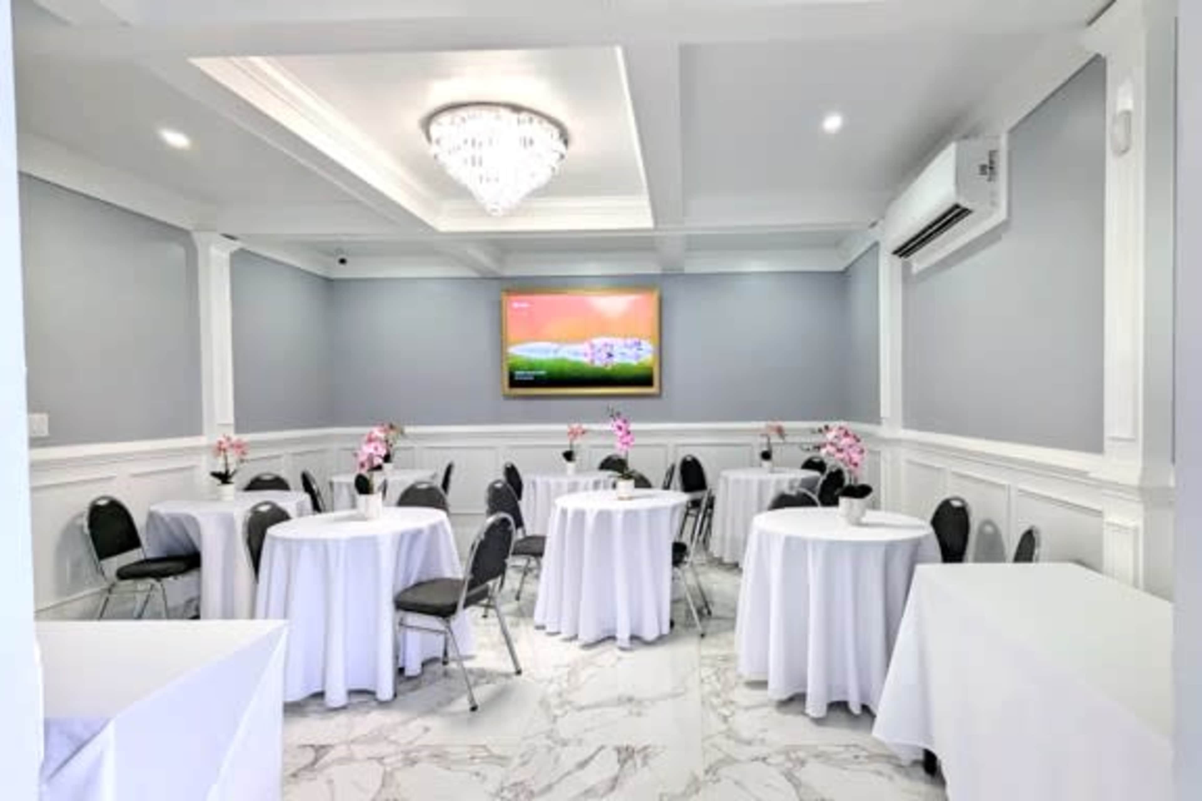 Indoor/outdoor event space with elegant room and private patio along the side of a restaurant. Image in , Decatur, GA