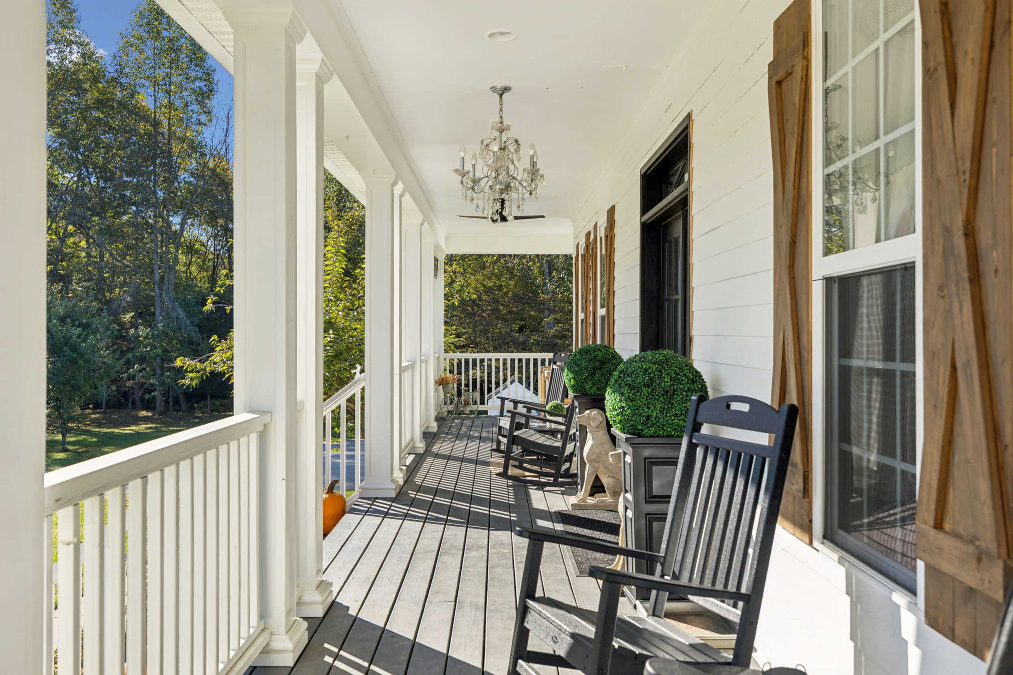 New Listing! A True Southern Porch — Wrap-Around Views, Rockers & Warm, Natural Light Image in , Fairview, TN