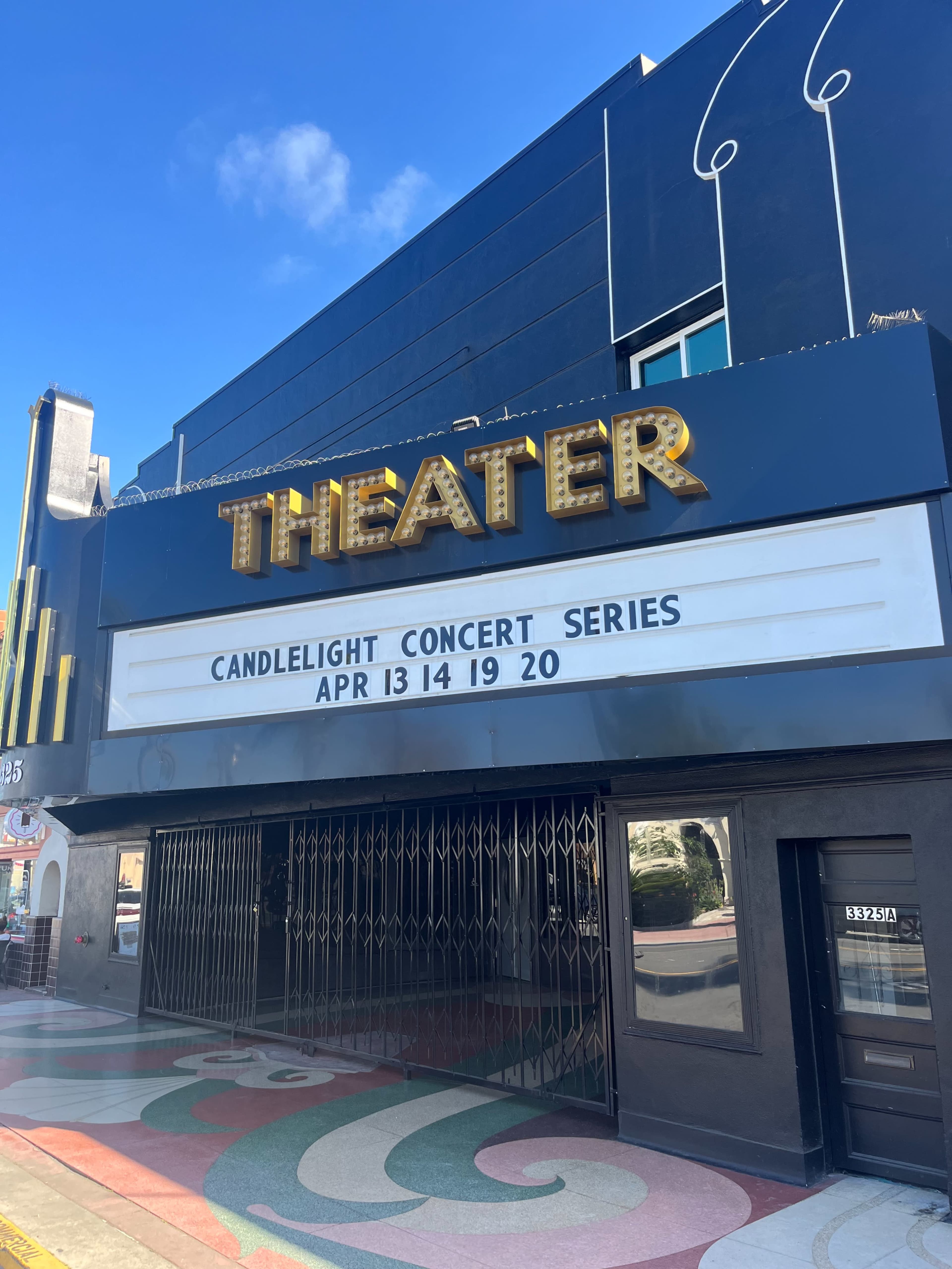 A theater marquee displays the words "CANDLELIGHT CONCERT SERIES" along with dates "APR 13 14 19 20."