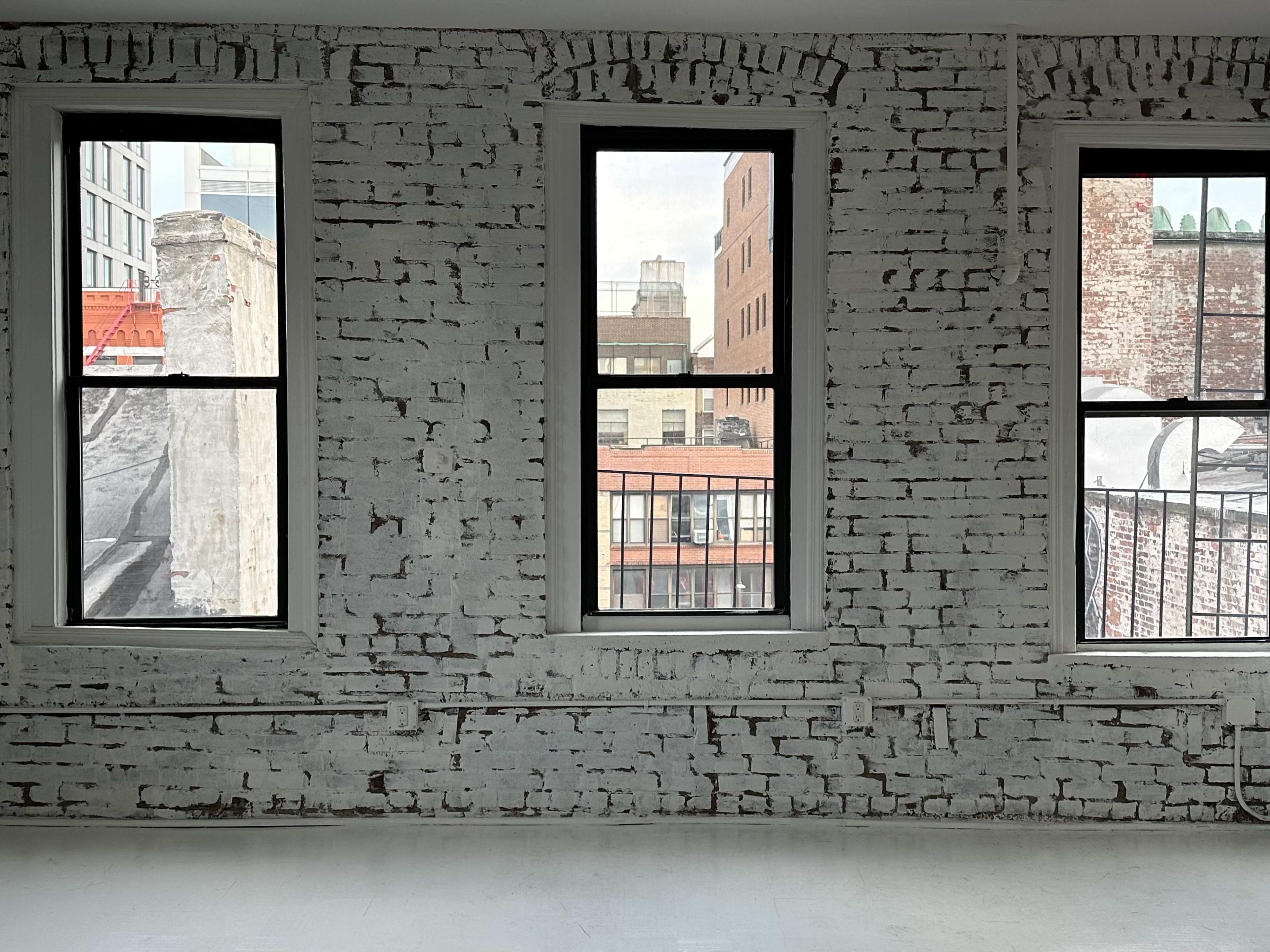 Artistic All-White Loft with Walls of Windows, Skylight & Unique Props Image in Little Italy, New York, NY