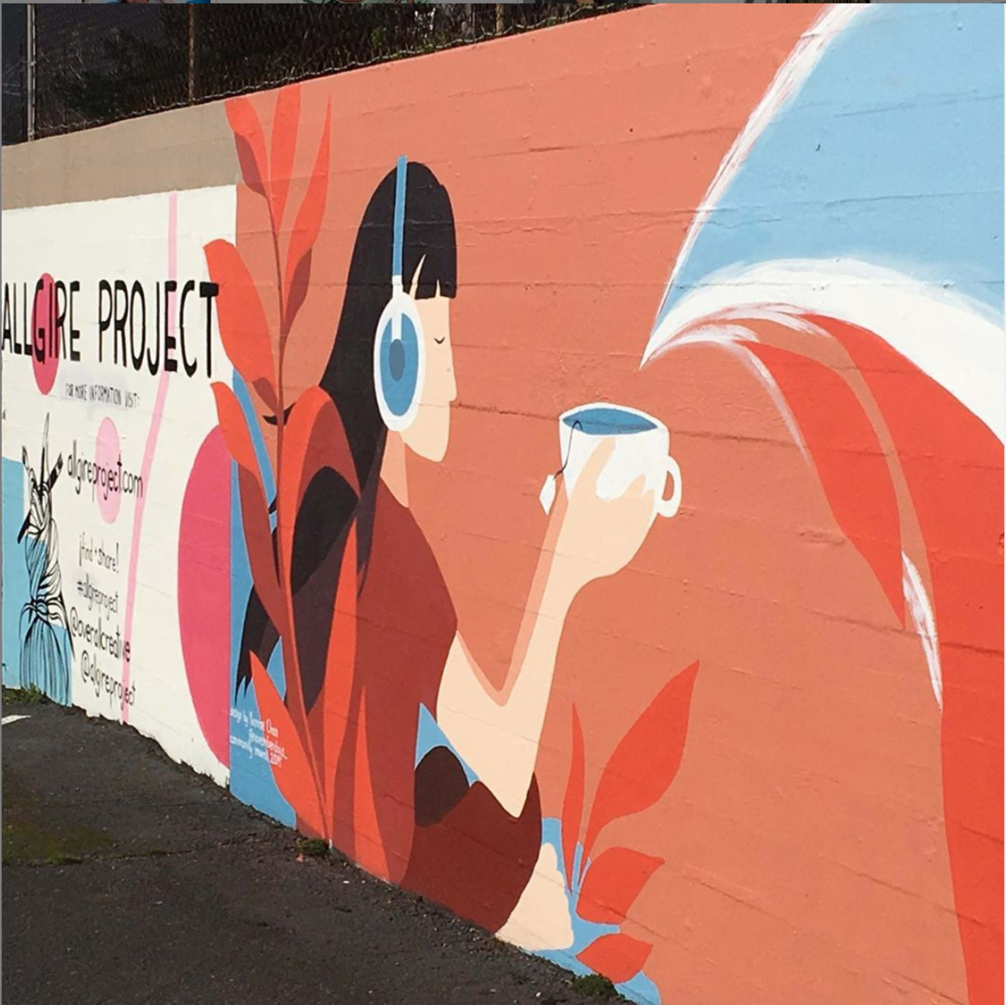 A mural features a woman with headphones holding a cup, surrounded by colorful plant designs and text promoting the "Allgire Project."