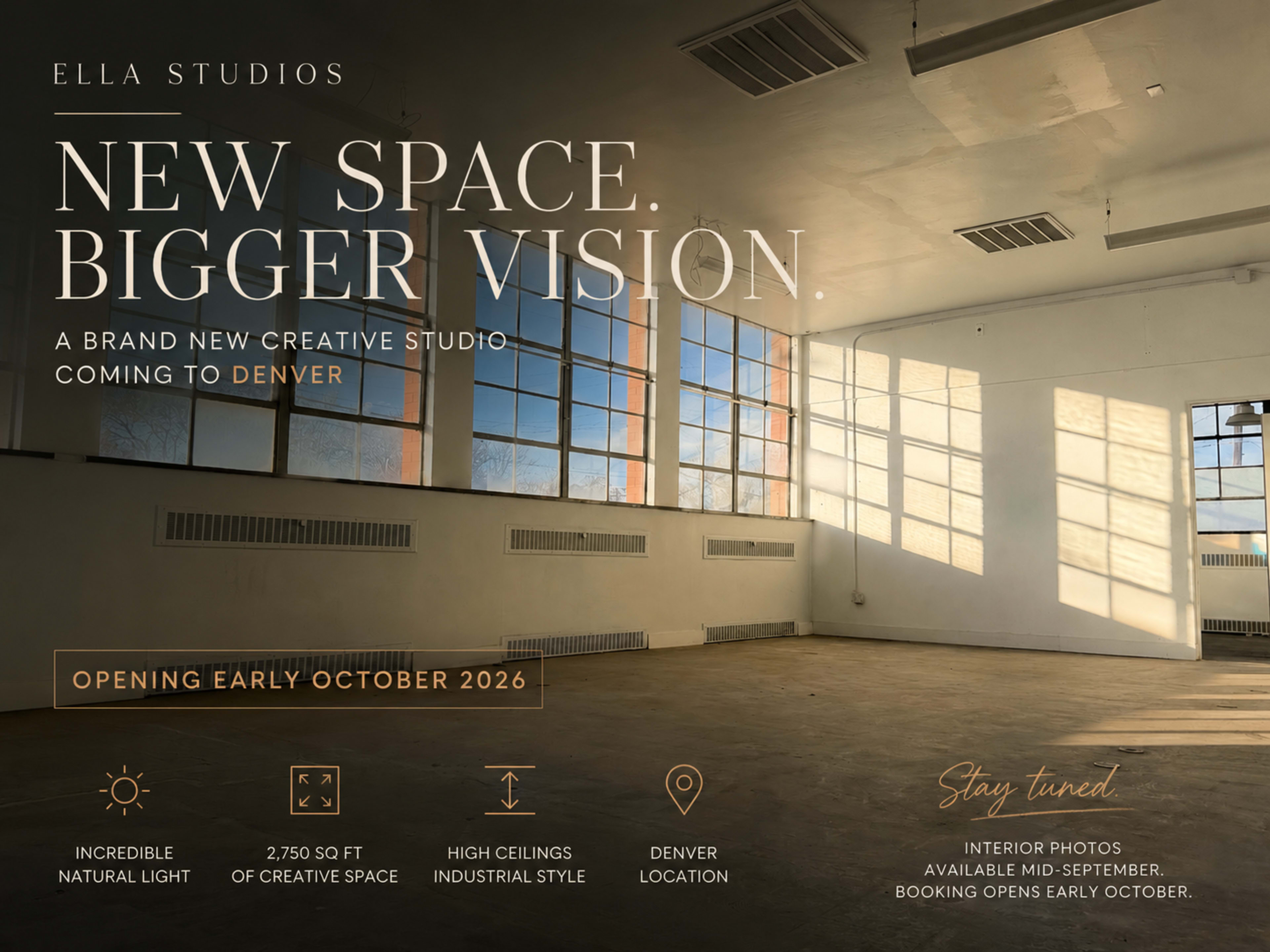 The image showcases a spacious, well-lit interior of a studio with large windows and high ceilings, highlighting a modern and industrial-style design.