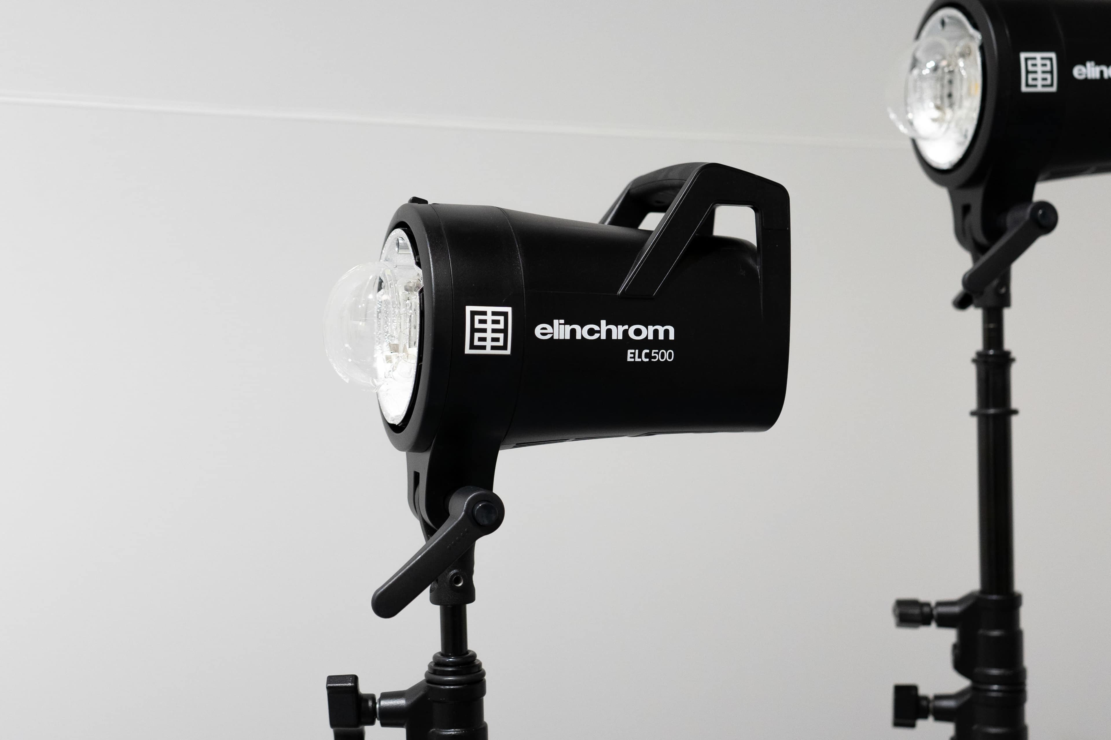 Two Elinchrom ELC 500 studio flash lights mounted on tripods.