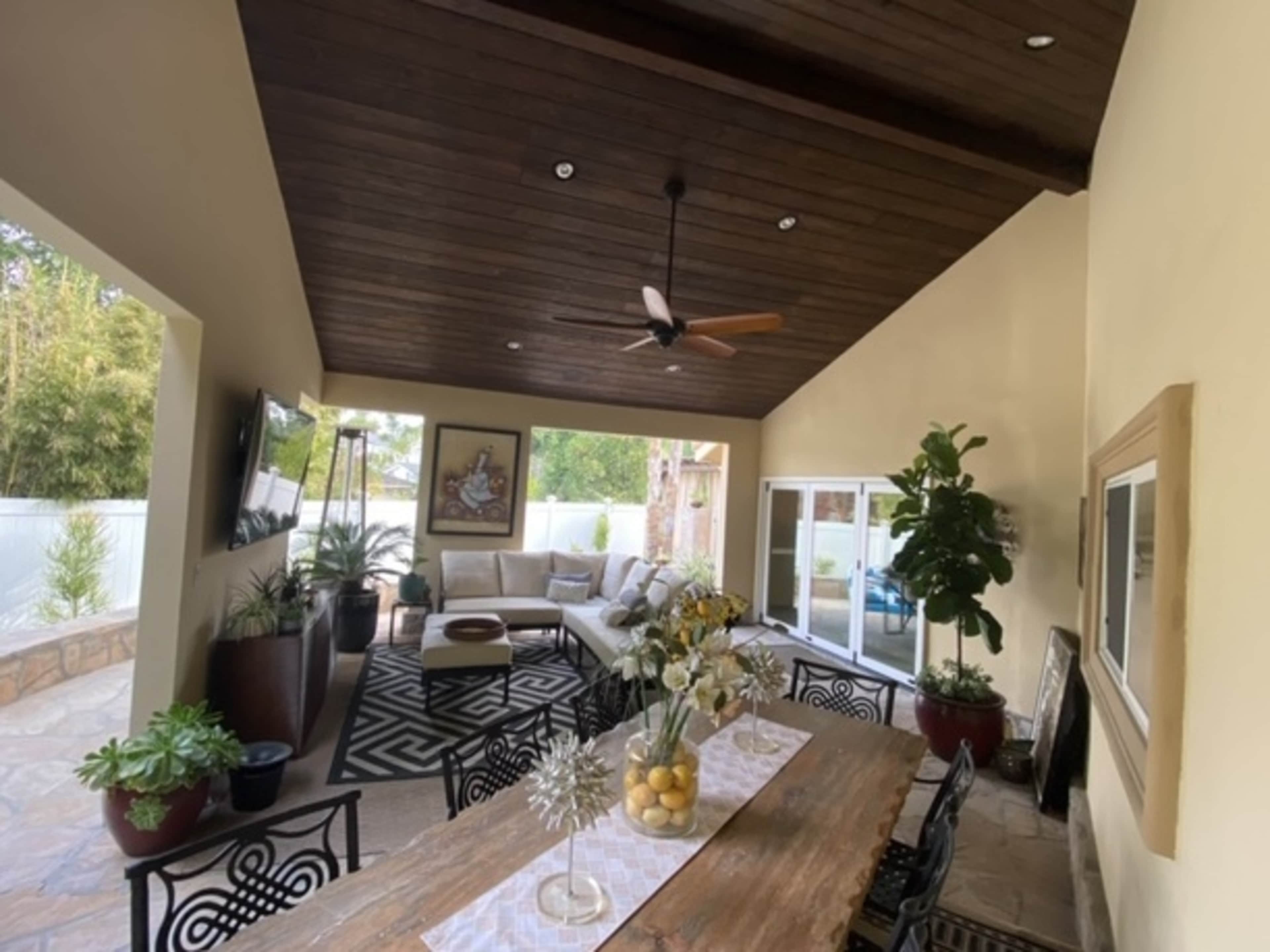 Additional covered lounge space with TV 
