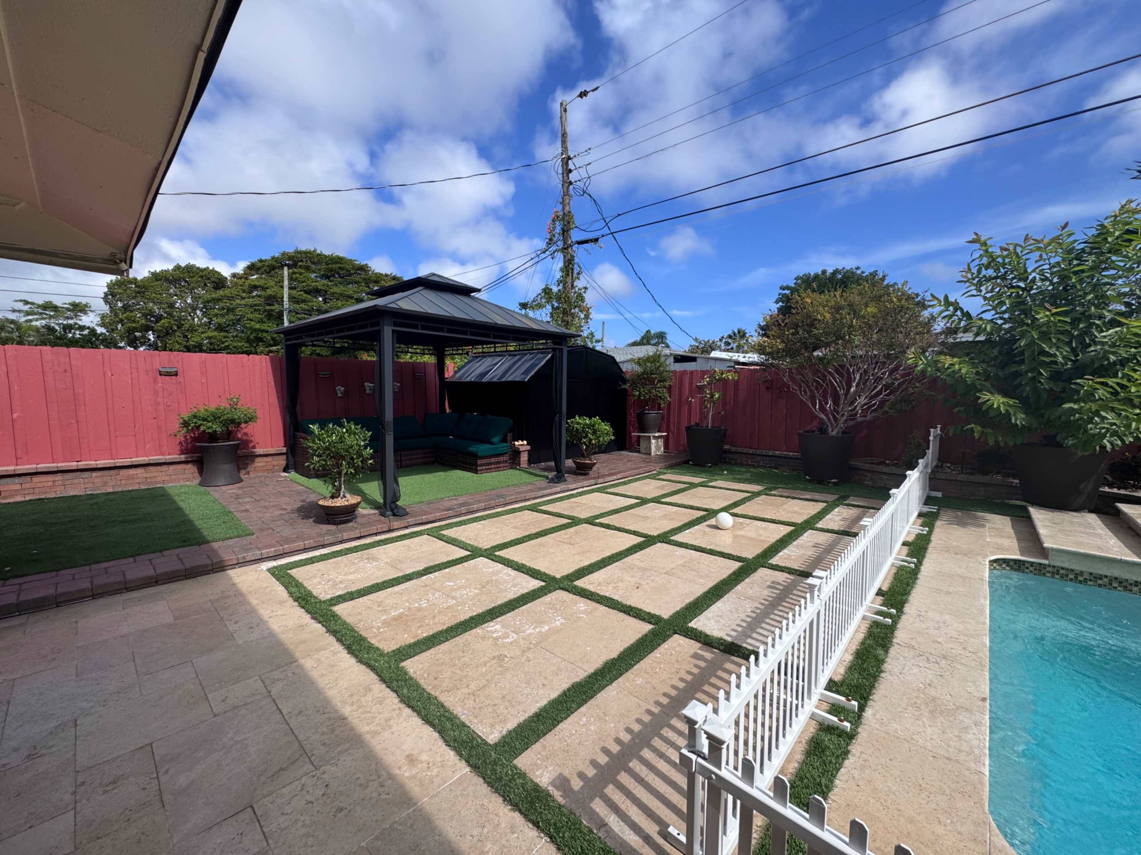 Spacious Backyard with Pool and Outdoor Kitchen Image in Pompano Beach, Pompano Beach, FL